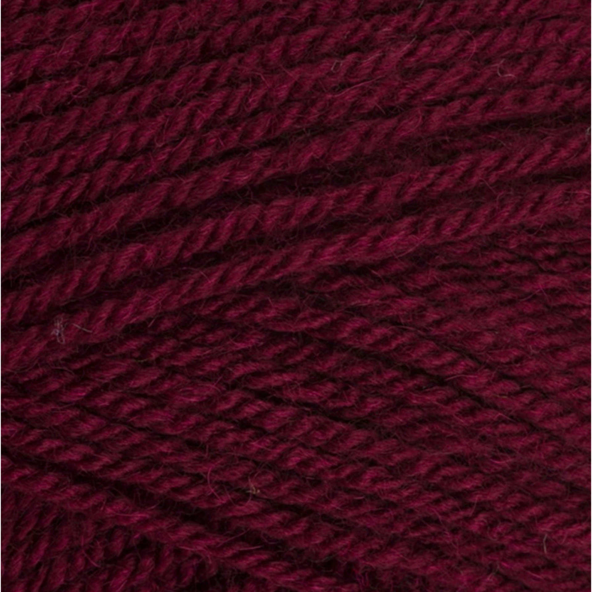 Close-up of Wendy Supreme DK yarn in the colour Burgundy (WD80), showing the deep rich burgundy red shade and smooth, even double knit texture.