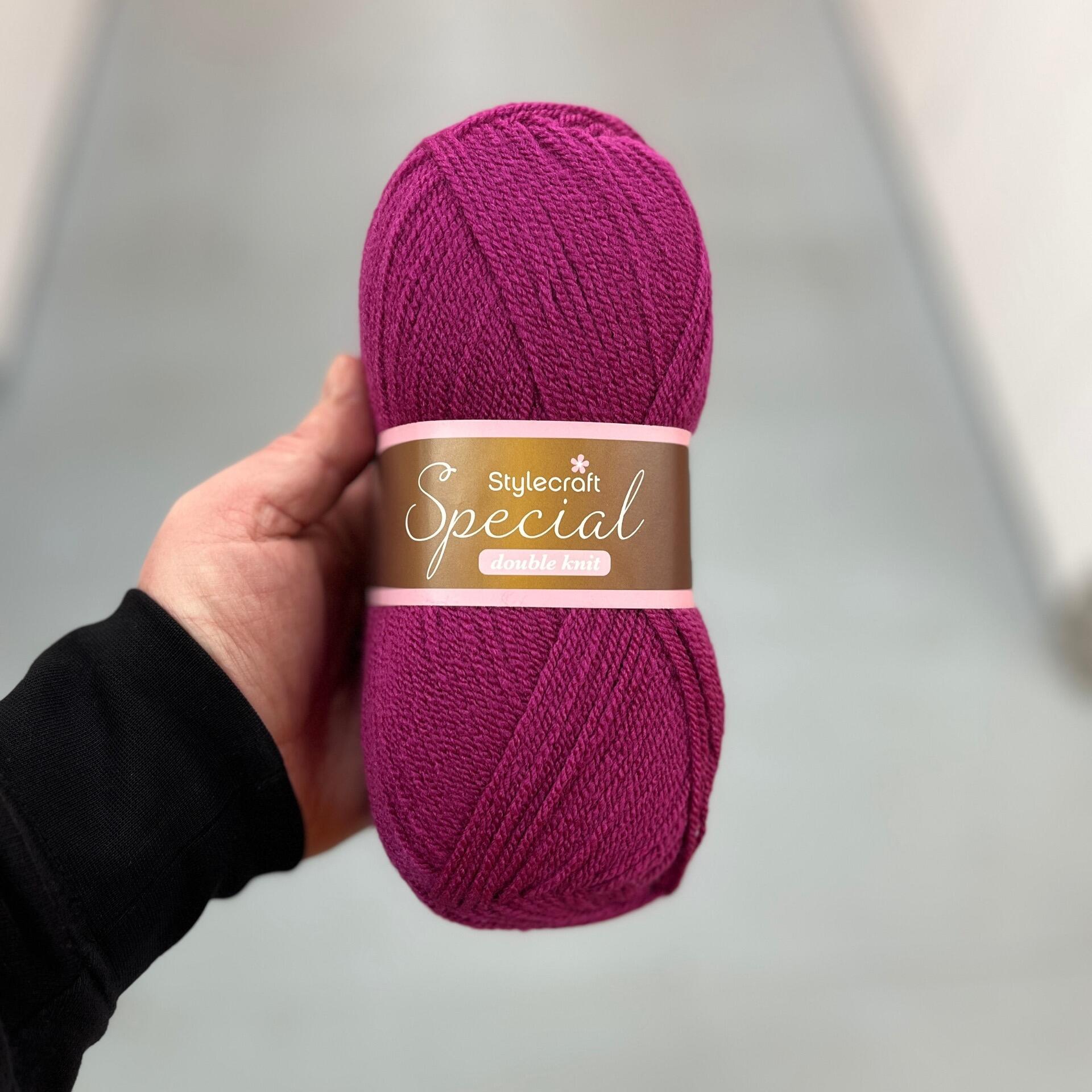 A ball of Stylecraft Special Double Knit yarn in the colour Boysenberry (1828).