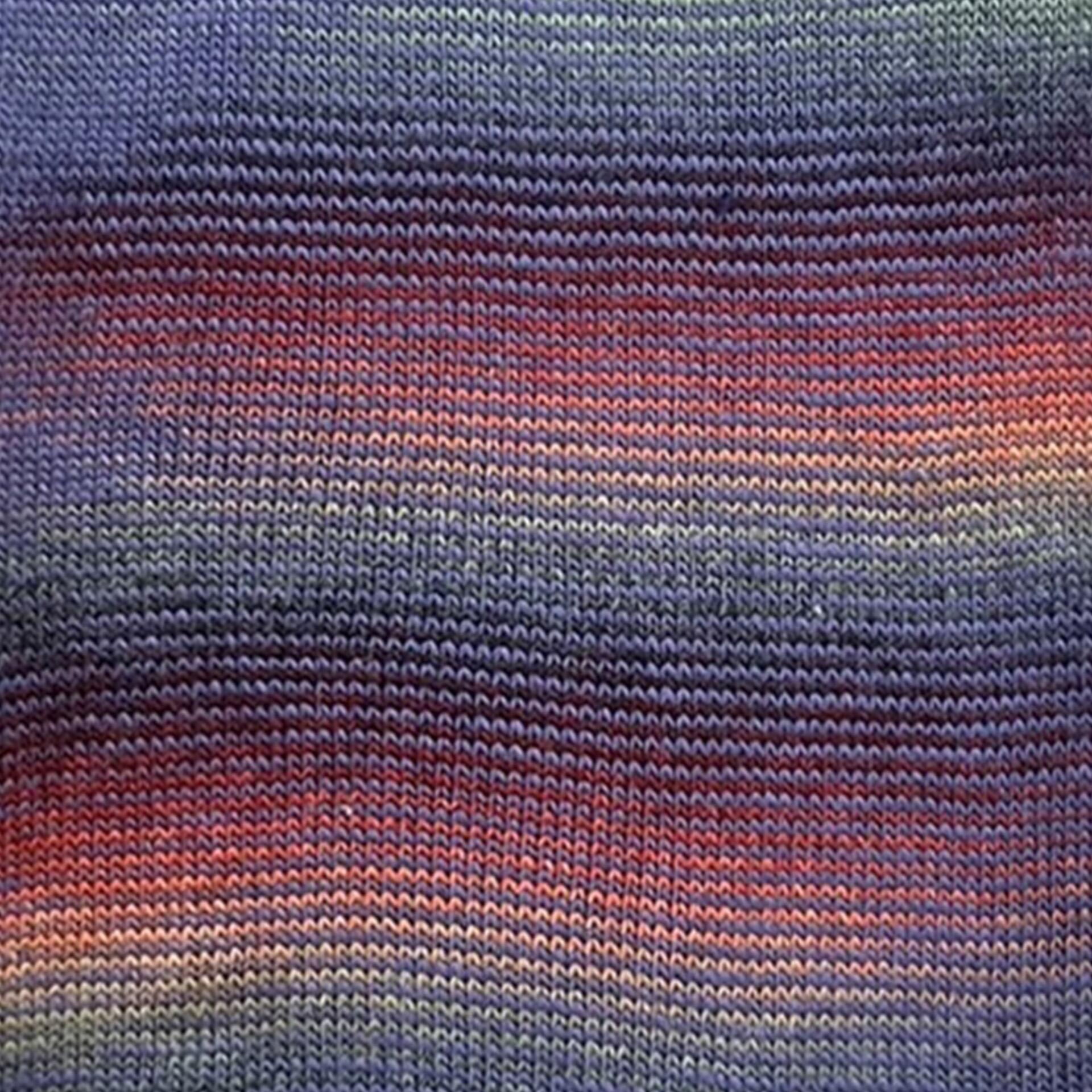 Knitted swatch of Stylecraft Knit Me Crochet Me Night yarn – self-striping DK with moody blue, purple, green and crimson stripes