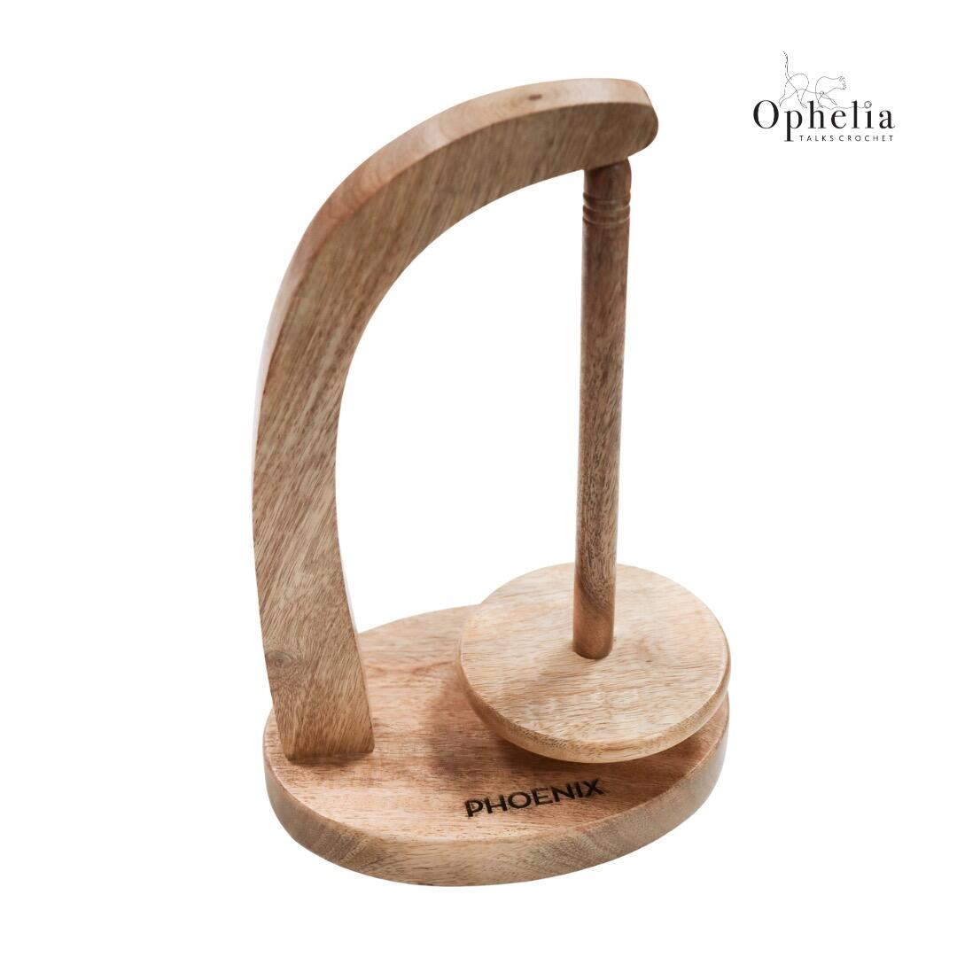 Handcrafted mango wood yarn concierge stand for holding yarn cakes, Phoenix wooden yarn holder – Ophelia Talks Crochet product photo.