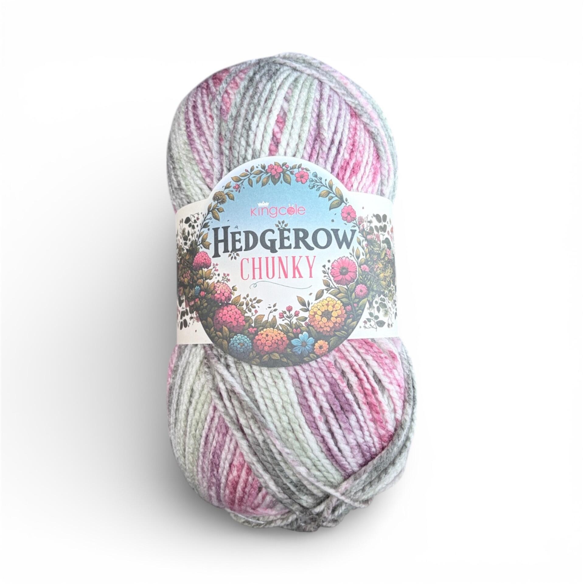 Ball of King Cole Hedgerow Chunky yarn in Hawthorn 5849, soft grey, pink and lilac variegated 100% acrylic chunky yarn, 200g ball on a white background.