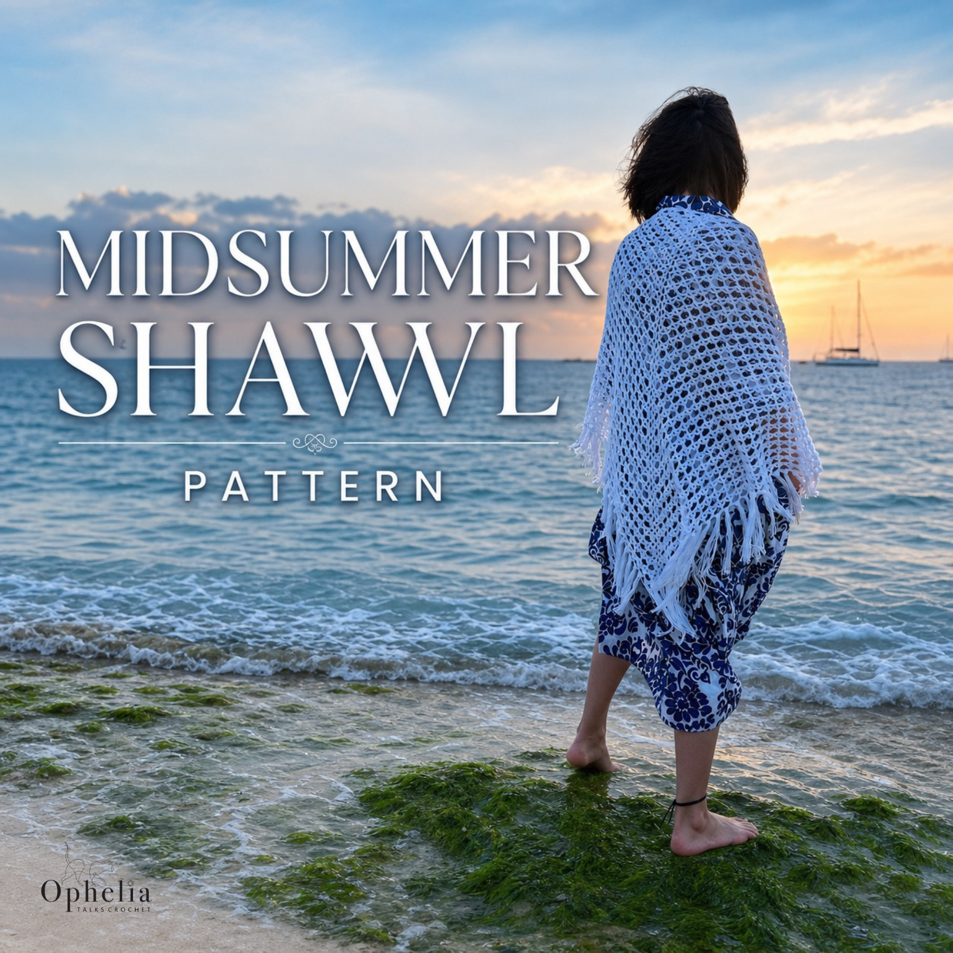 White handmade Midsummer crochet shawl with tassels worn at the seaside, shown against a soft ocean background with Midsummer Shawl Pattern text.