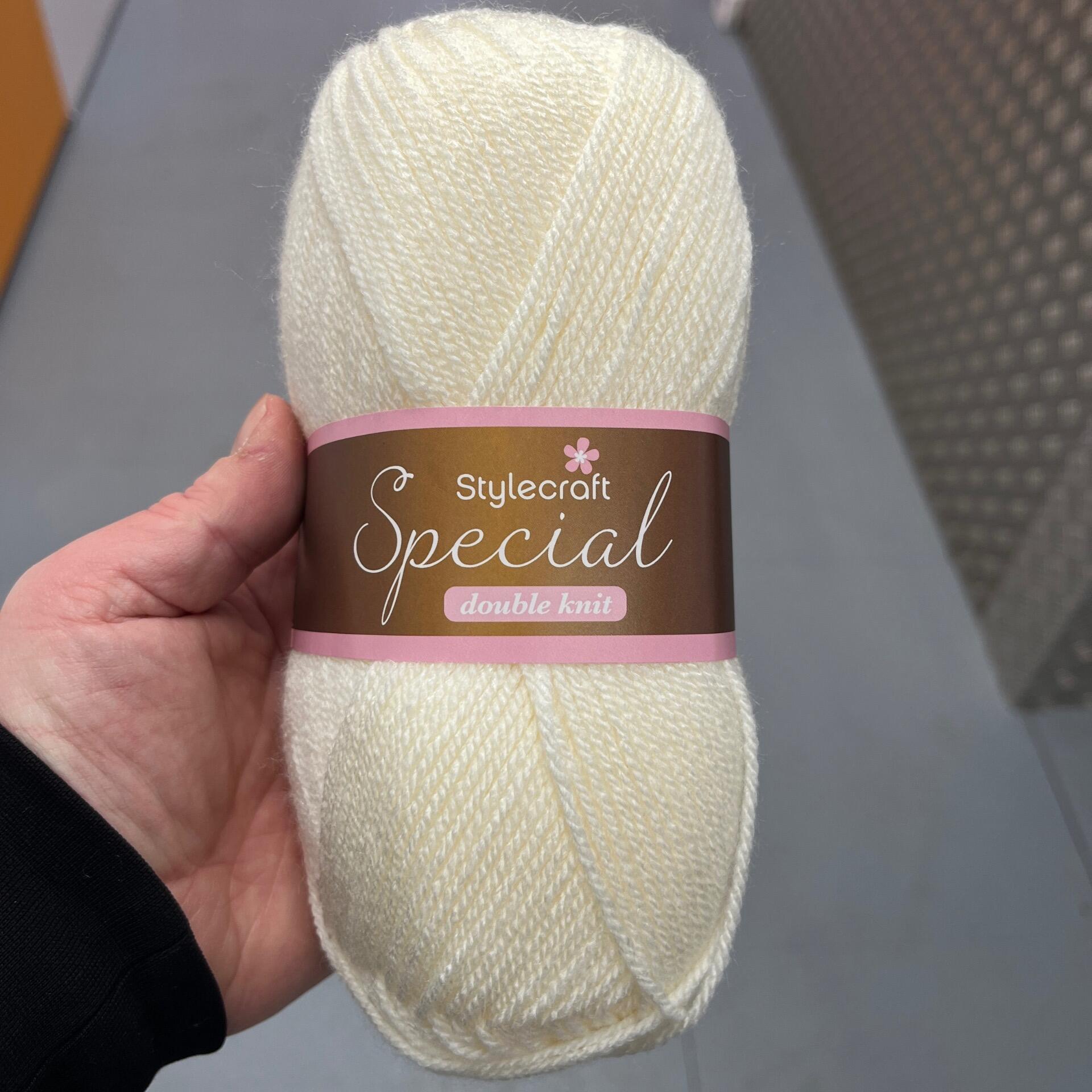 A ball of Stylecraft Special Double Knit yarn in the colour Cream