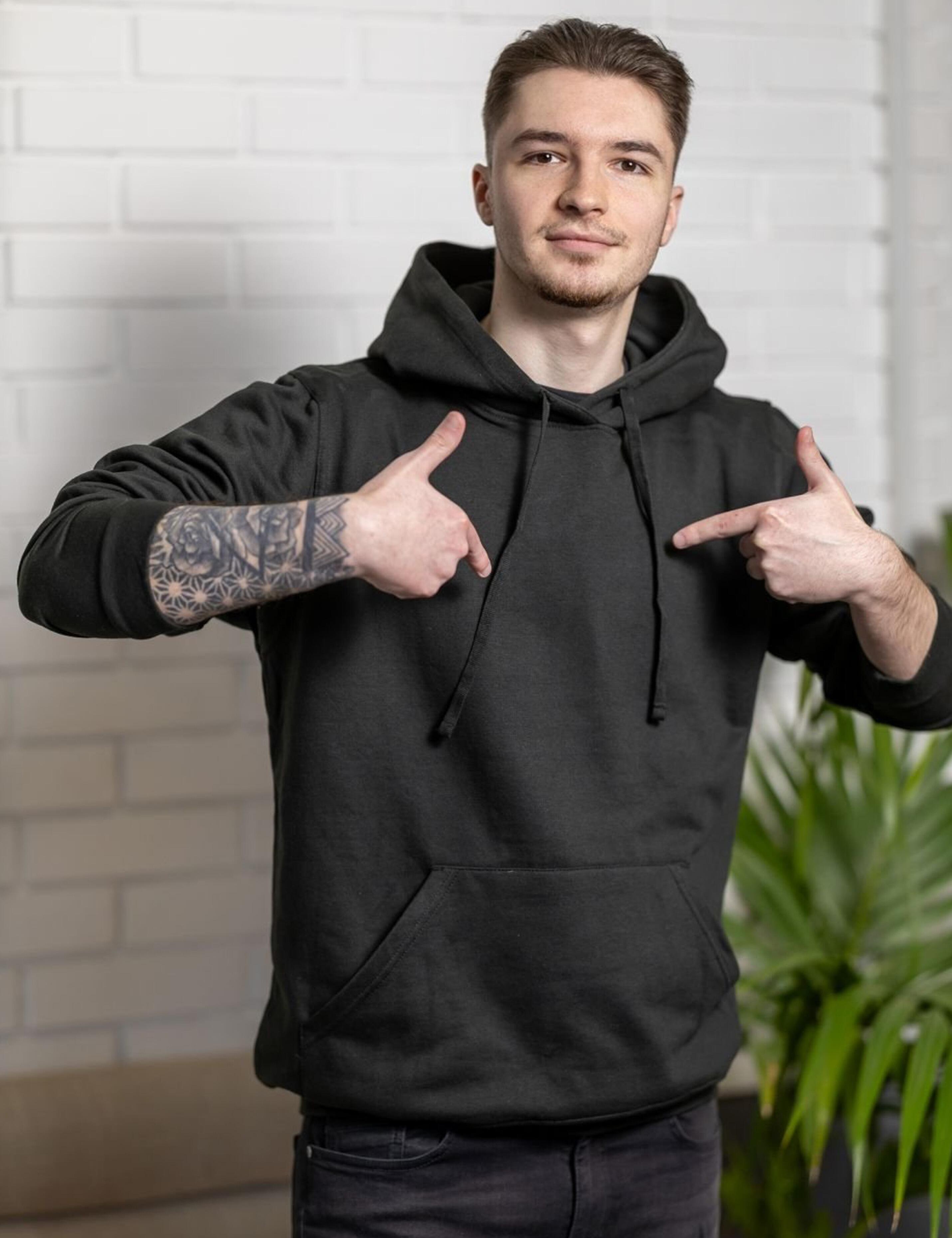 Versatile black hoodie for work, leisure, or layering