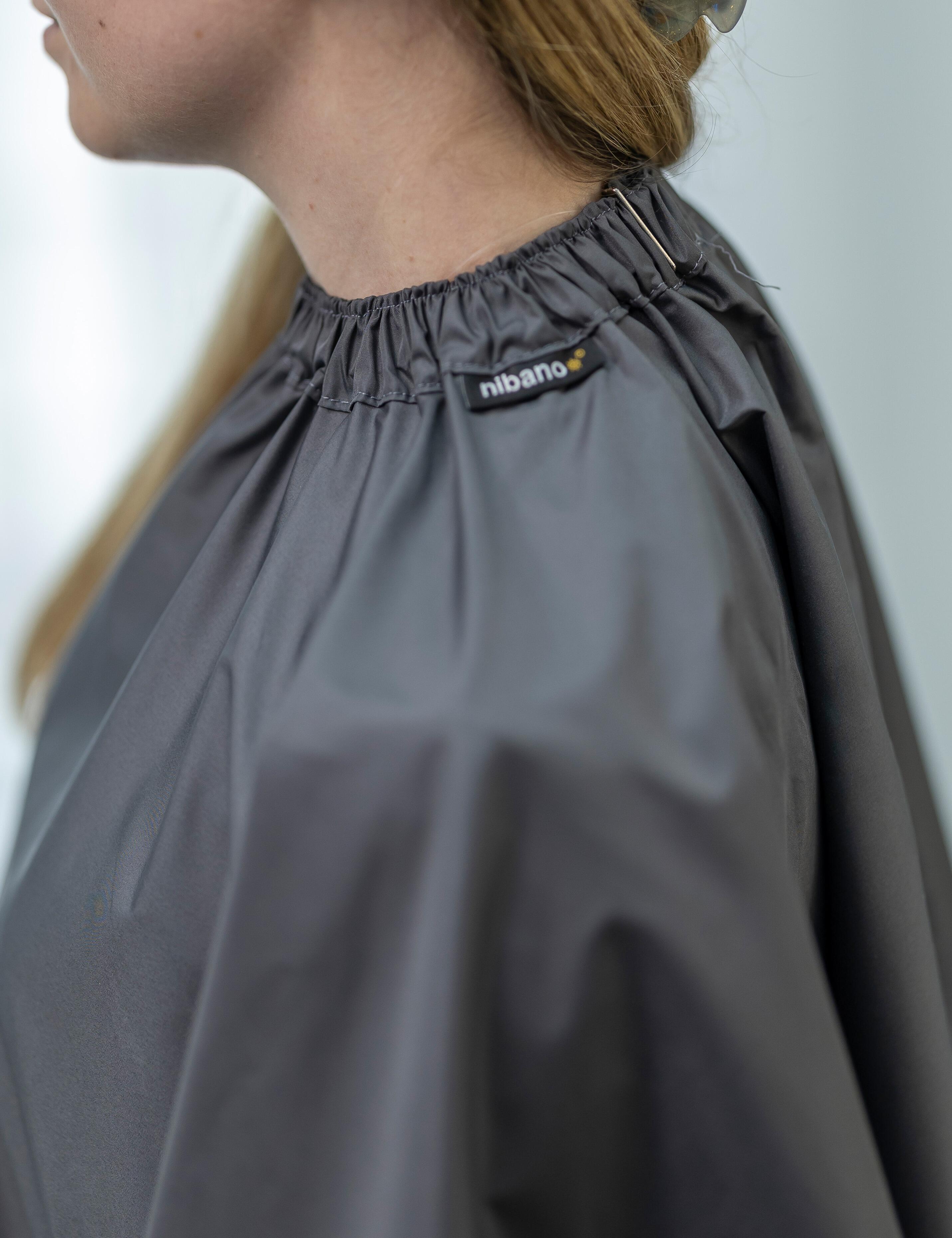 Hairdresser's protective cape with hand slits dark grey with clips