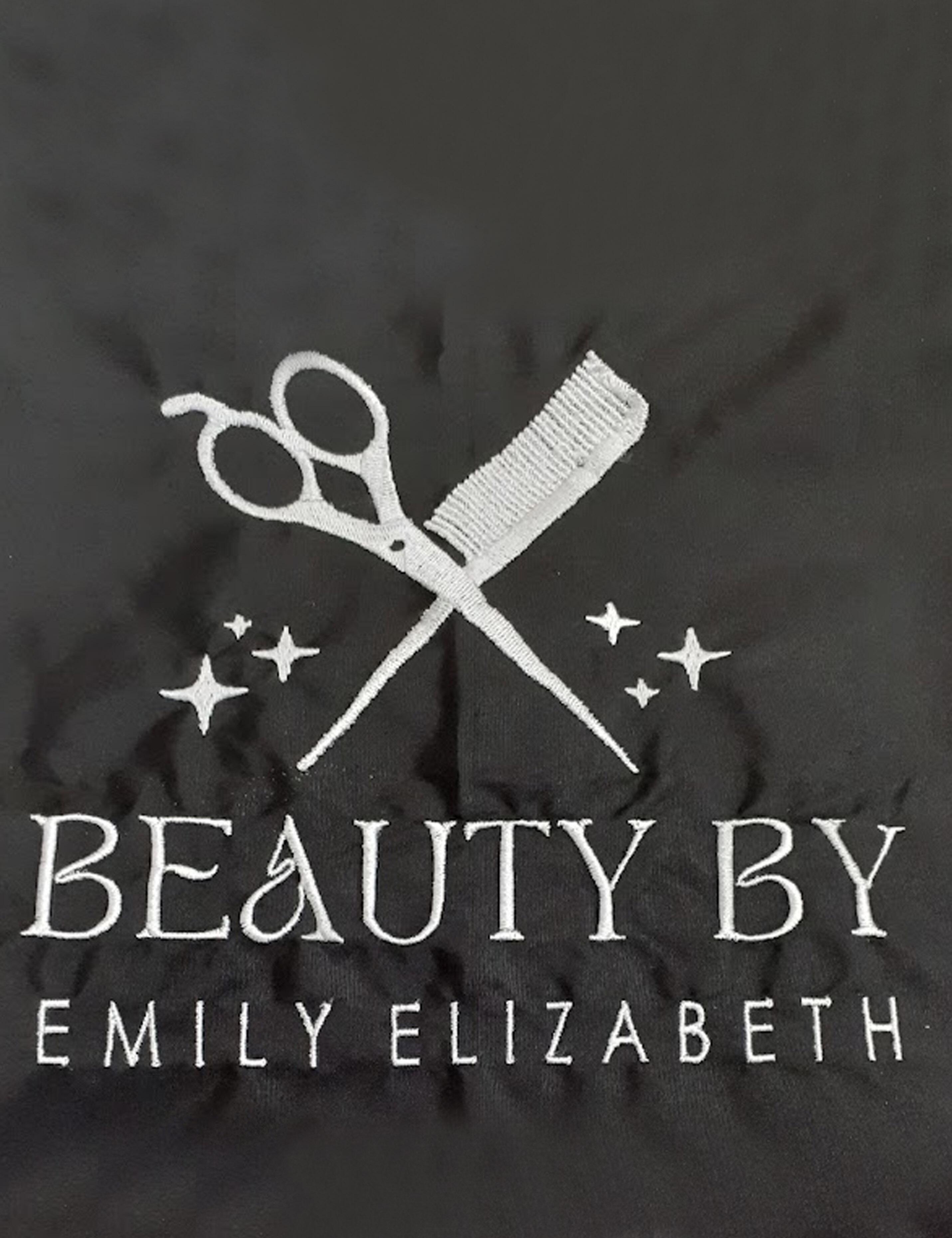 Premium black salon cape with custom embroidery design