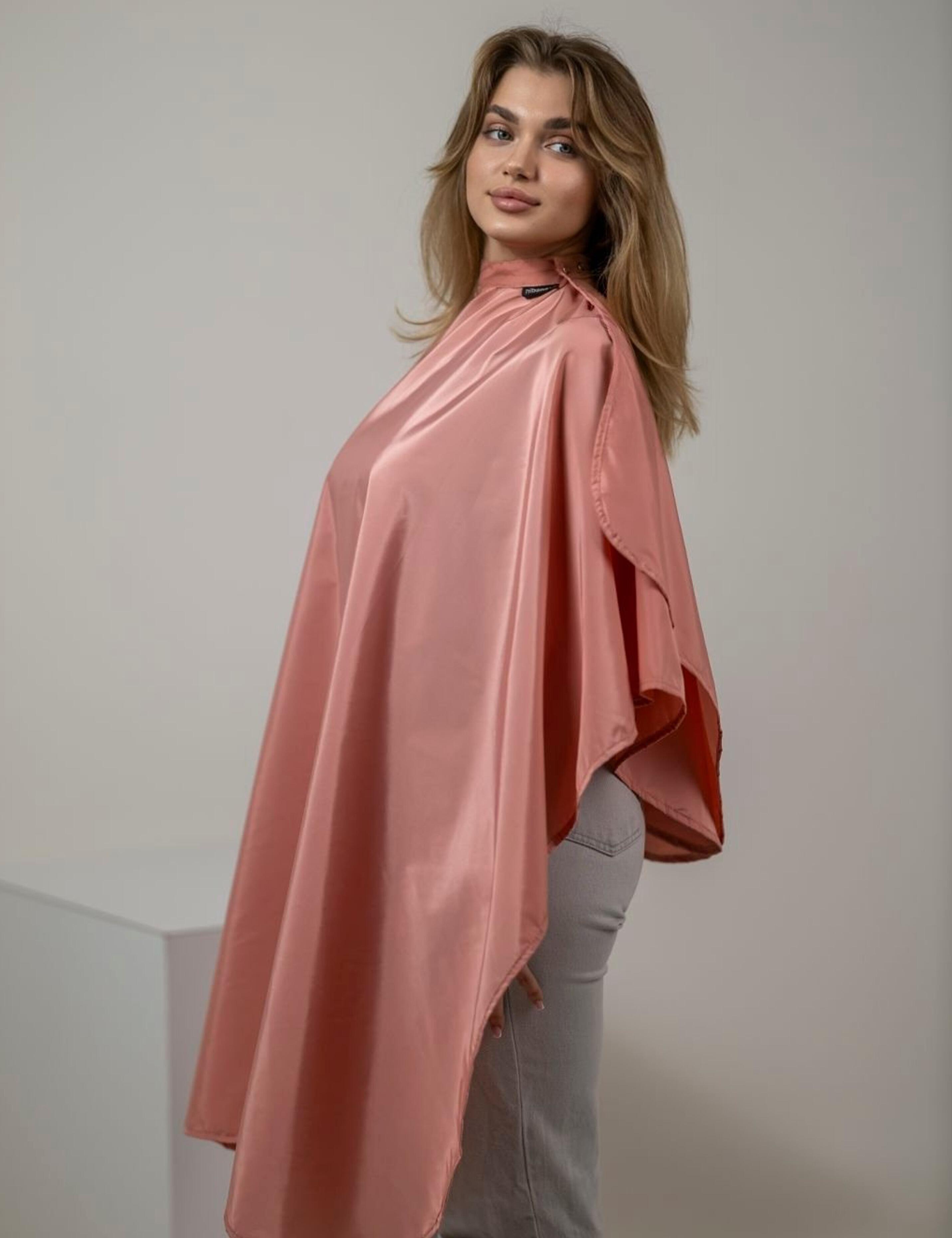 Stylish peach salon gown for hairdressers with modern fit and design