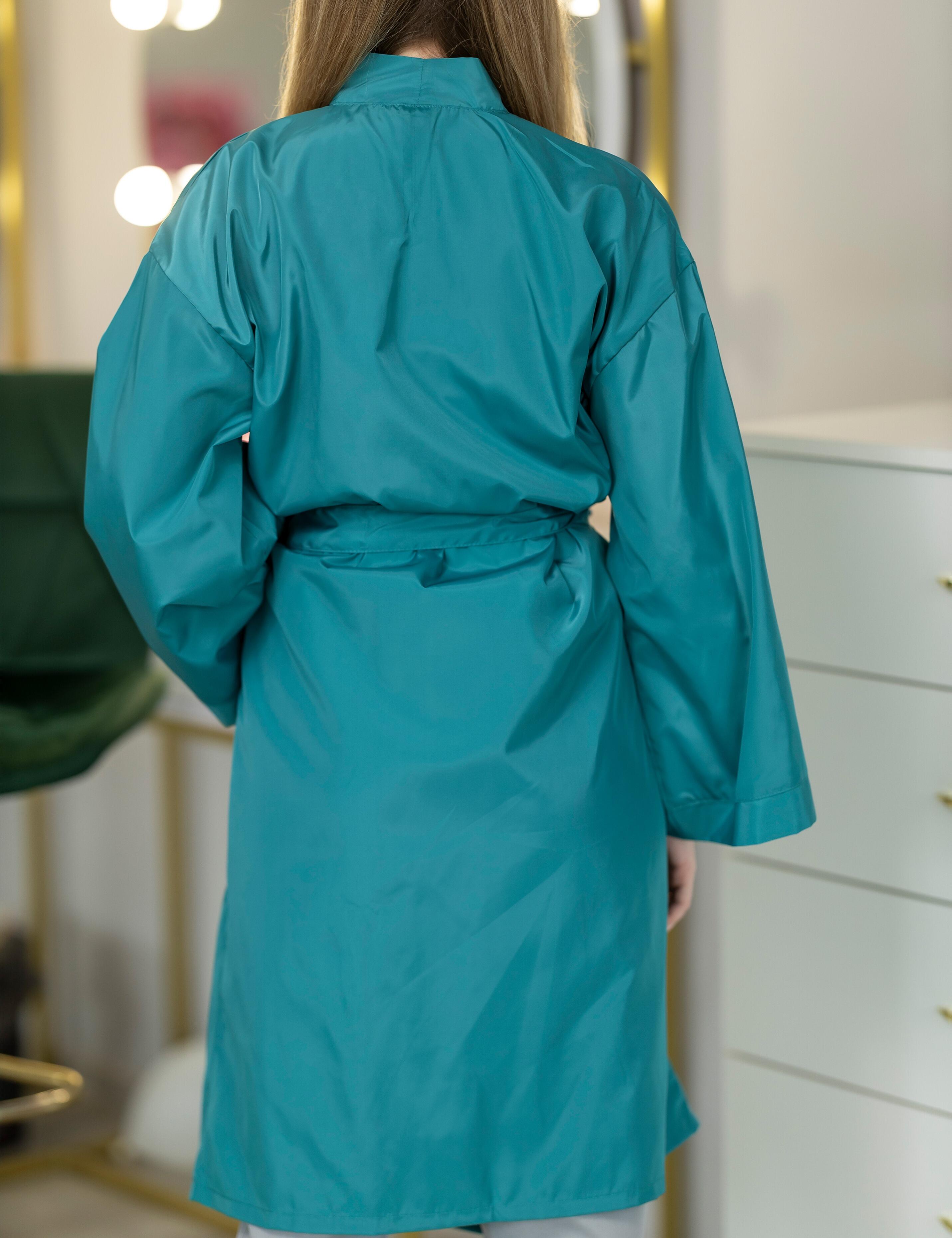 Fade proof teal professional robe built to maintain its rich colour after heavy washing