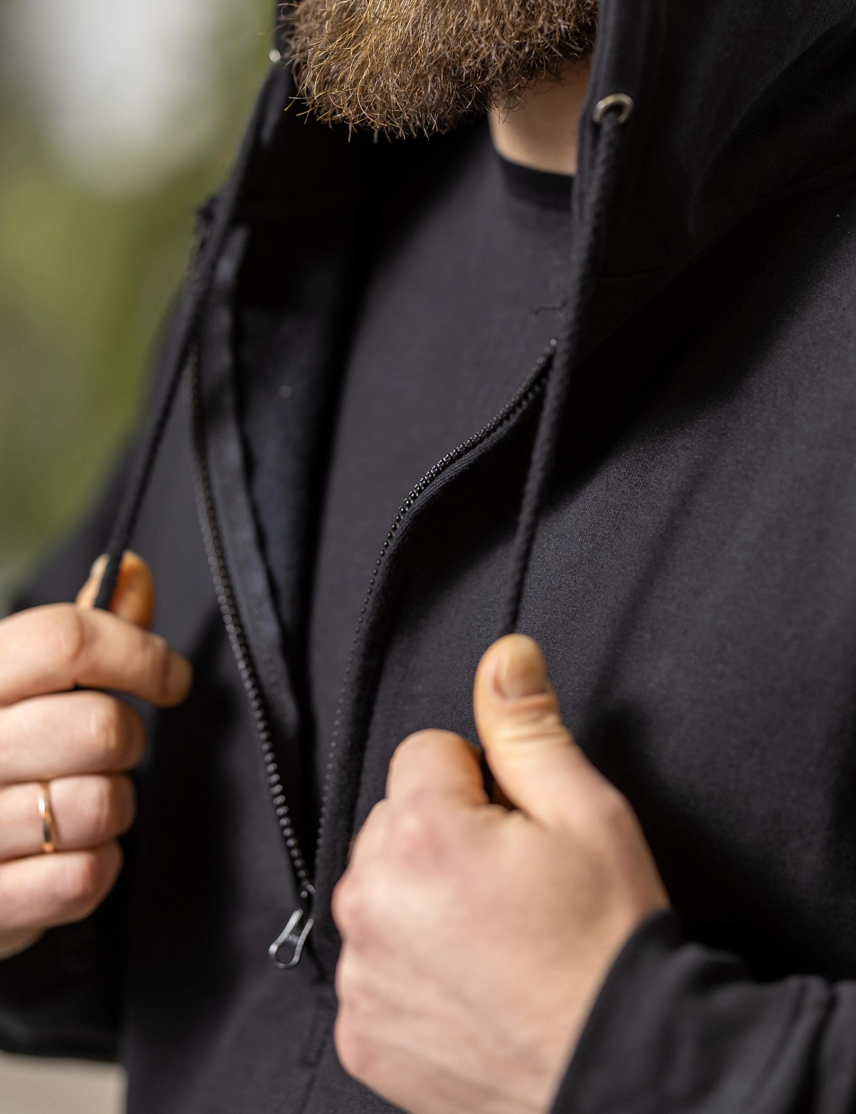 Modern black hoodie with full zip, embroidery, and print design