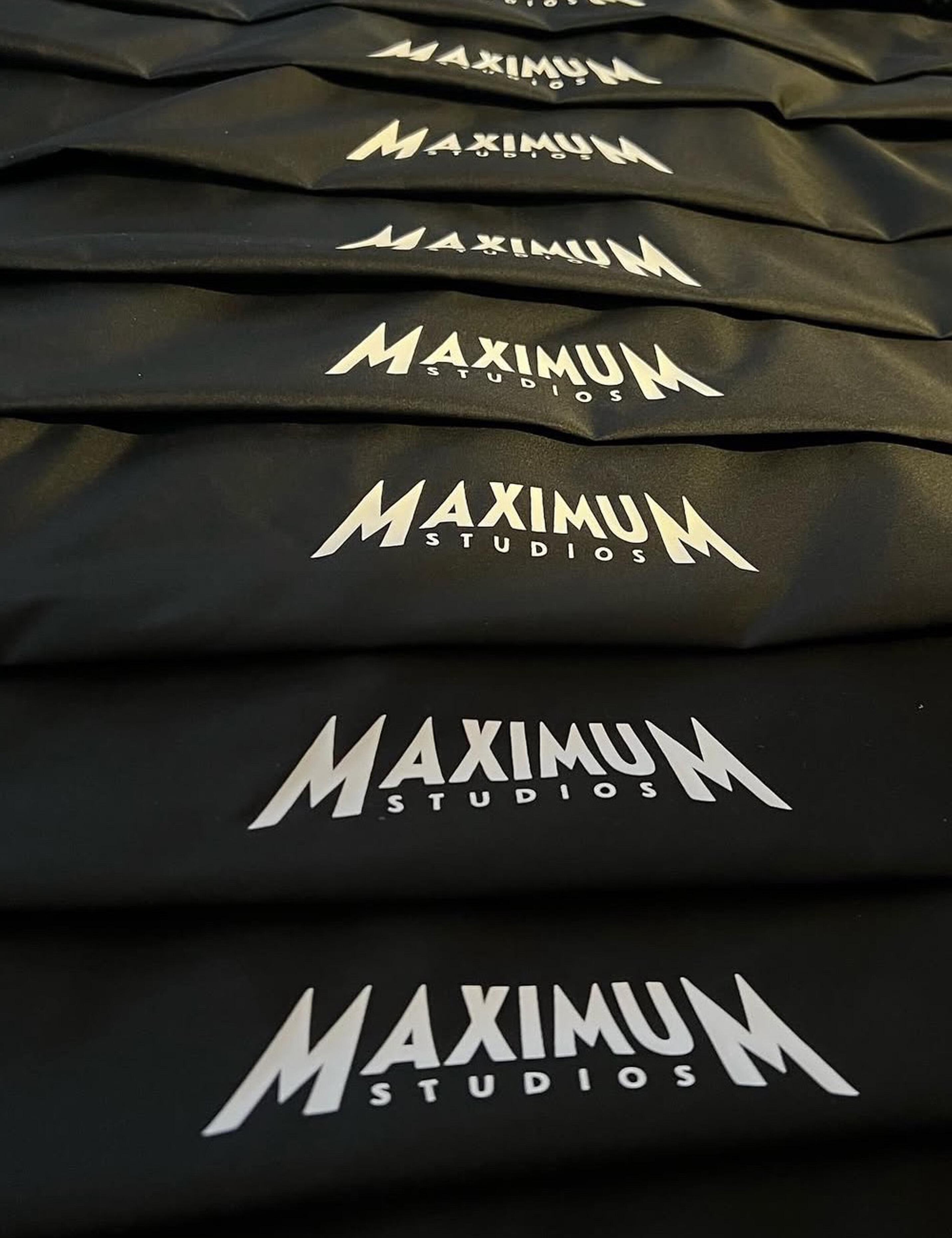 Black hairdressing cape with custom printed design for salons