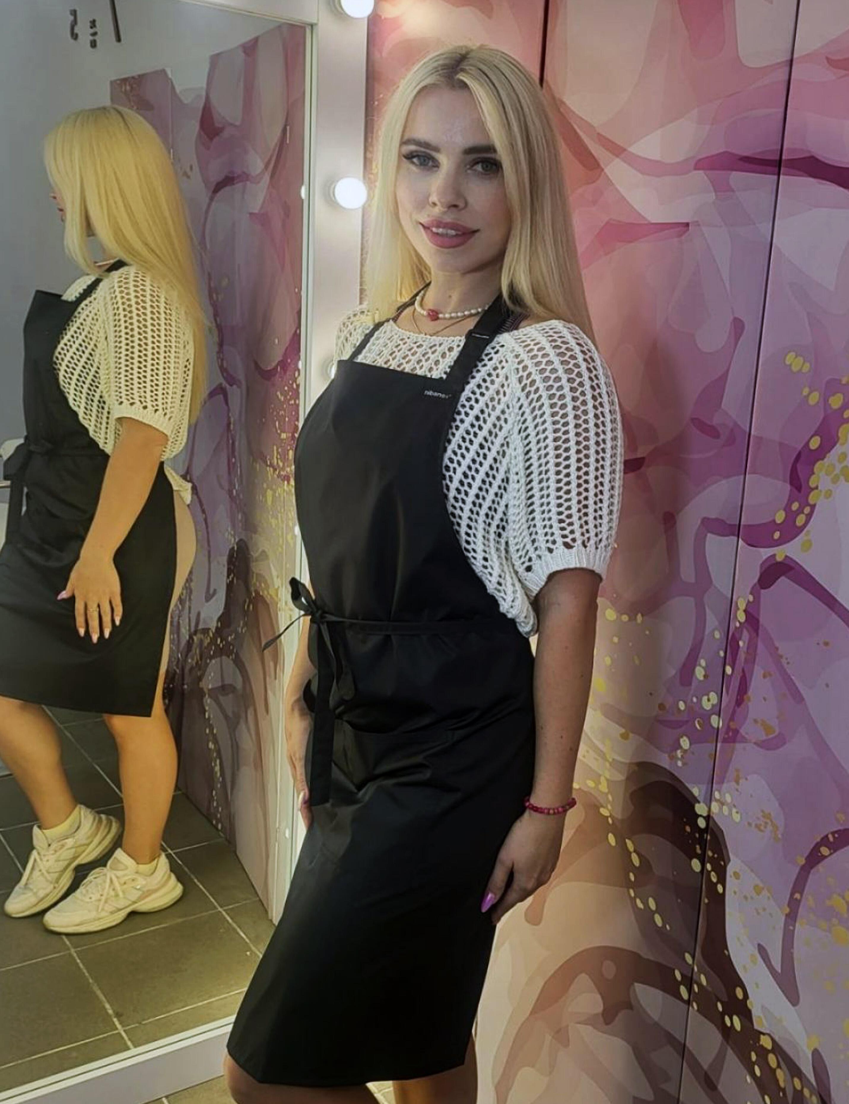 Durable black waterproof bib apron for salons, cafés and hospitality