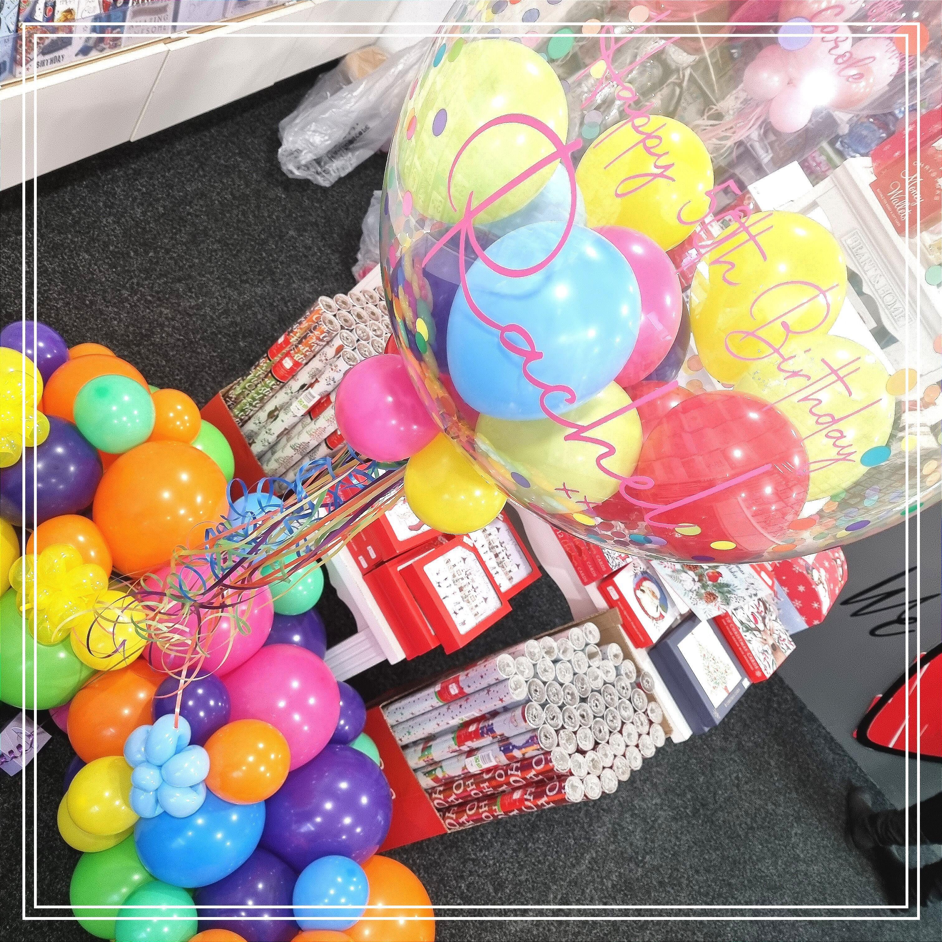 Luxury personalised bubble balloon with organic garland base