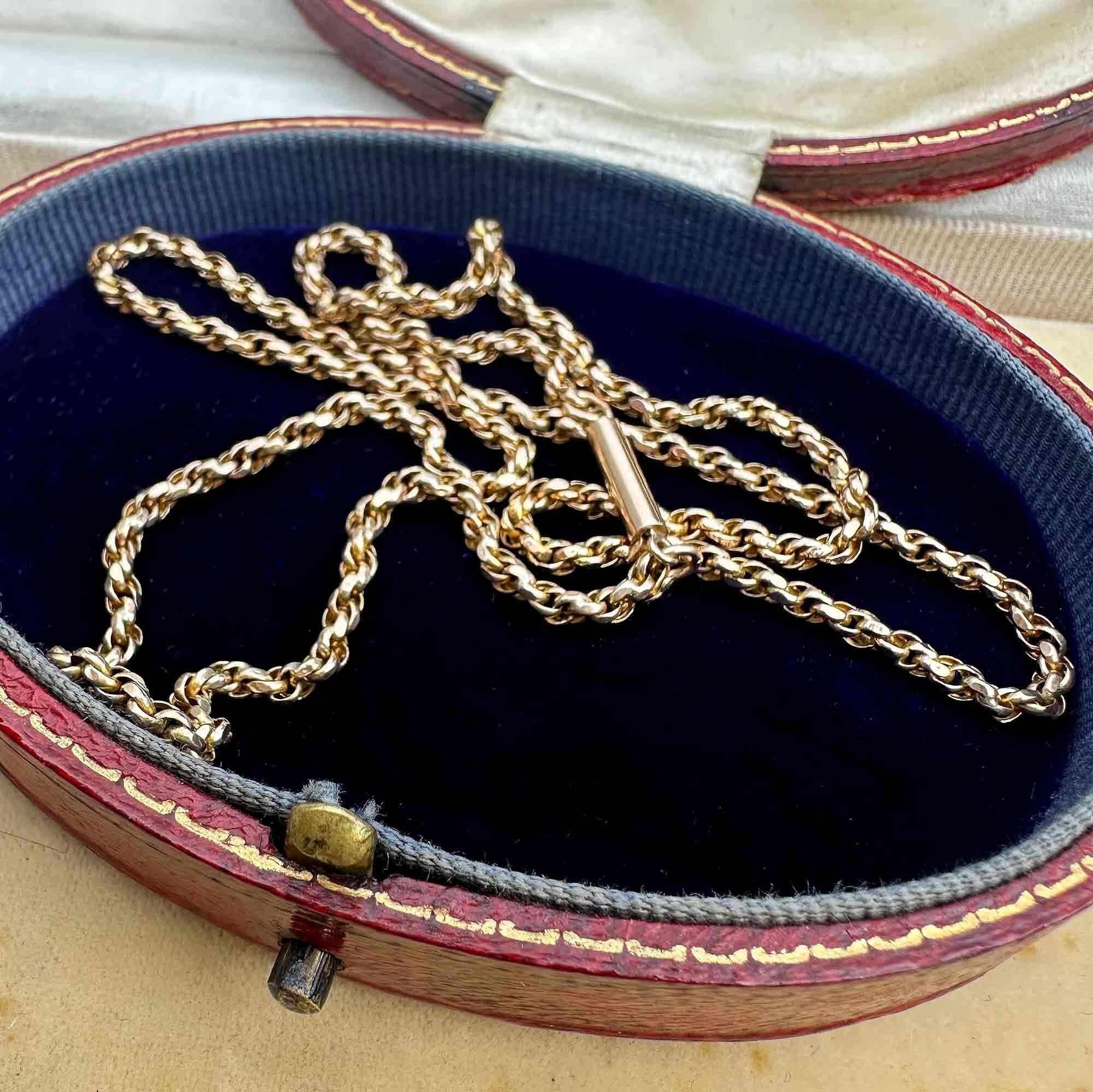 Antique 9ct gold rope chain necklace with classic barrel clasp, displayed in antique box.