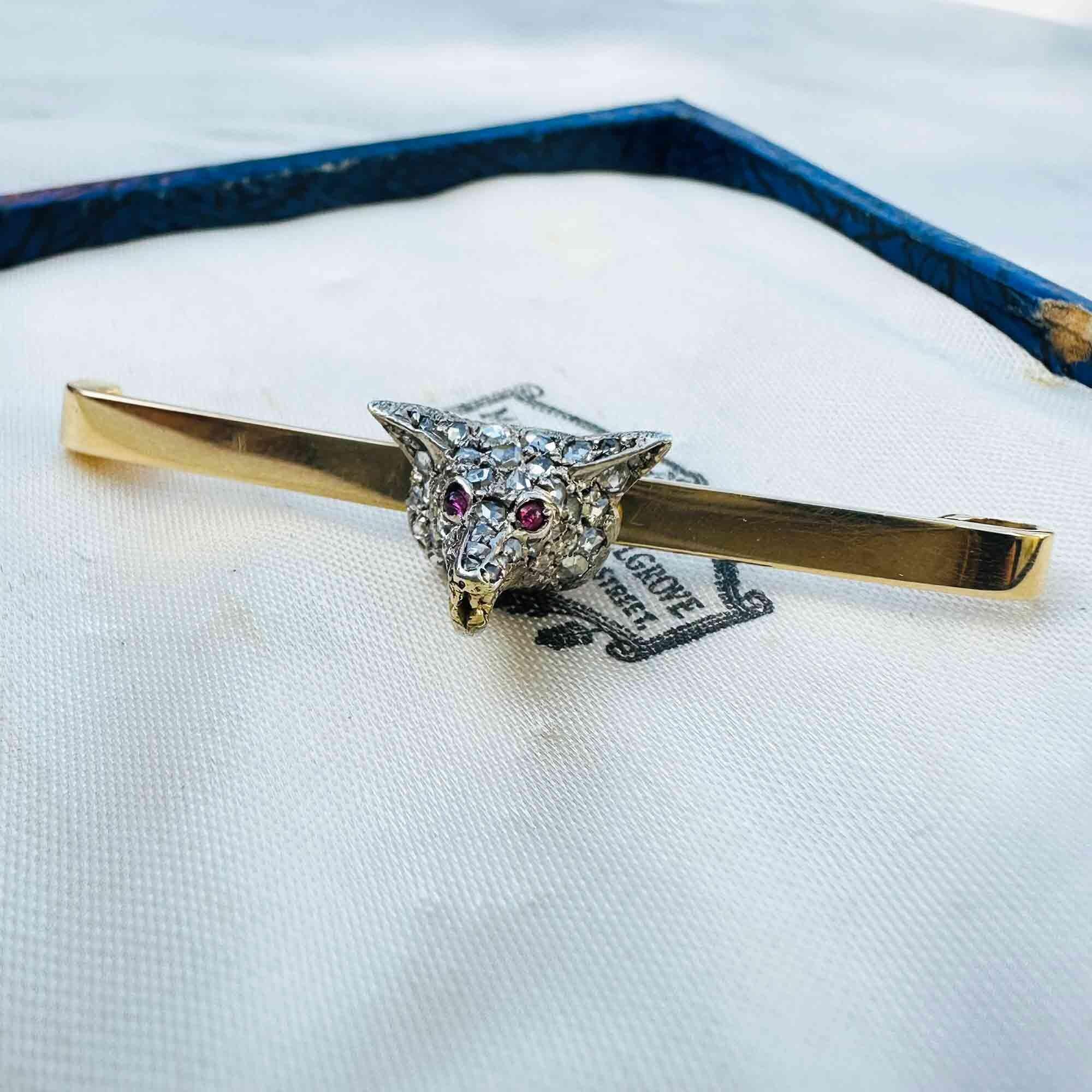 Antique diamond fox head brooch with rose cut diamonds, ruby eyes, and gold teeth detail