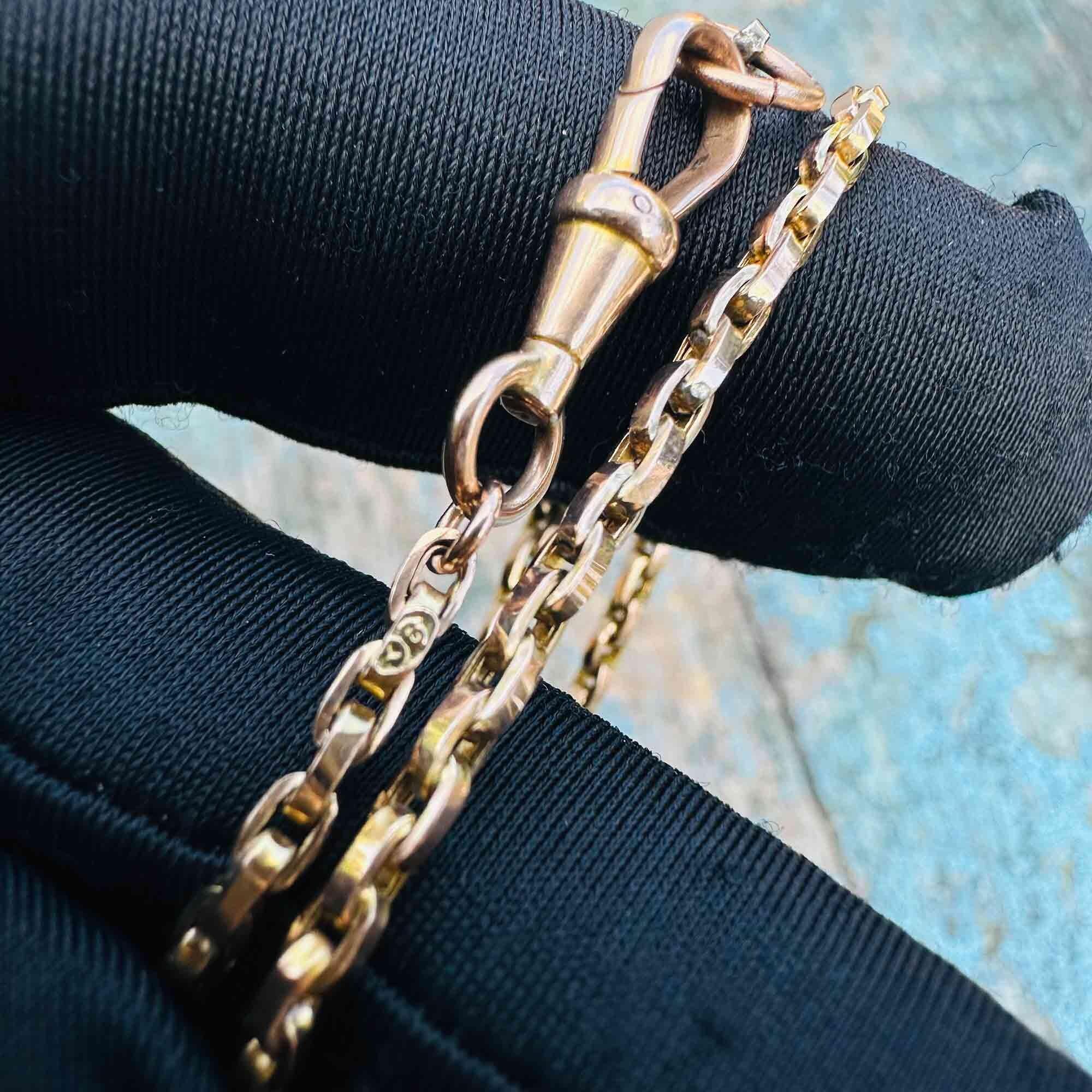 Detail of antique rose gold chain with dog clip fastening