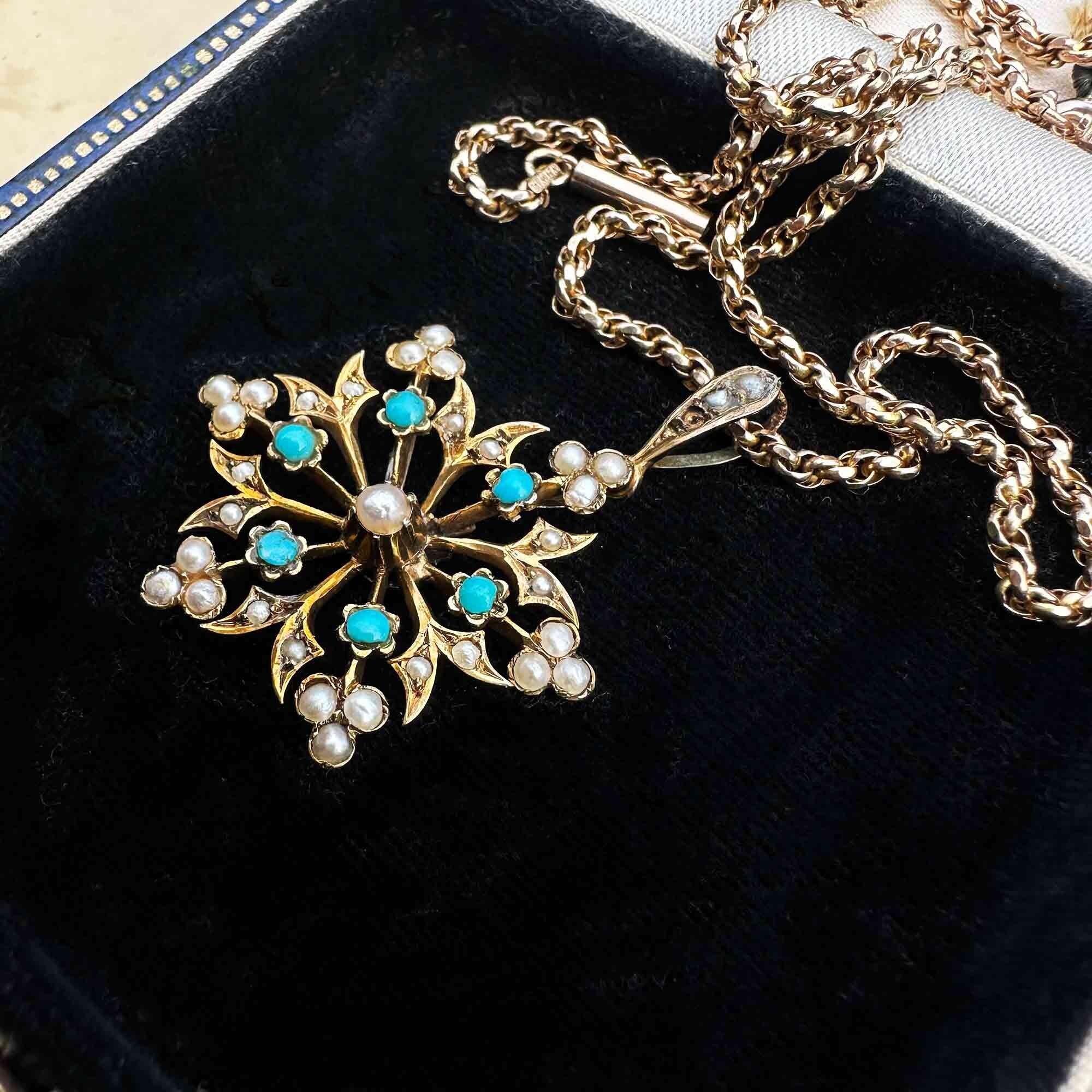 antique 9ct gold Turquoise and pearl starburst pendant on black velvet antique box.