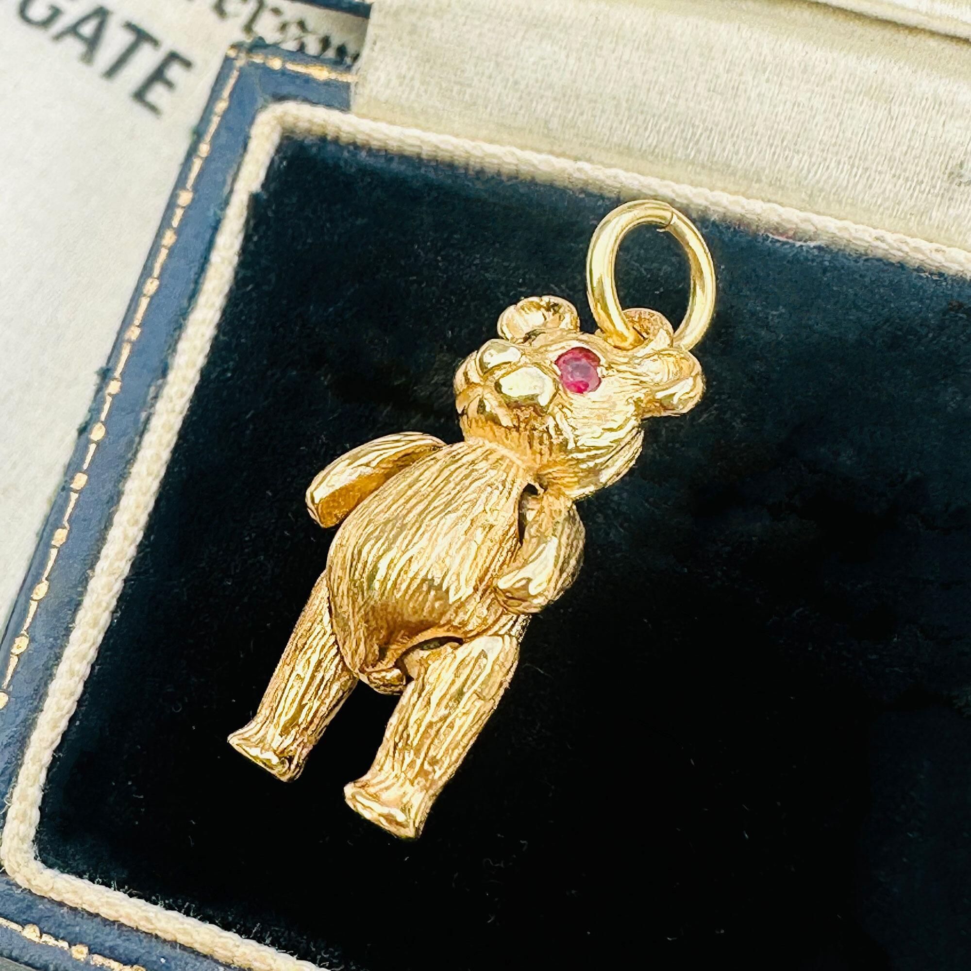 Vintage 9ct Gold Teddy Bear Pendant: Ruby Eyes, Articulated London Charm displayed in antique box