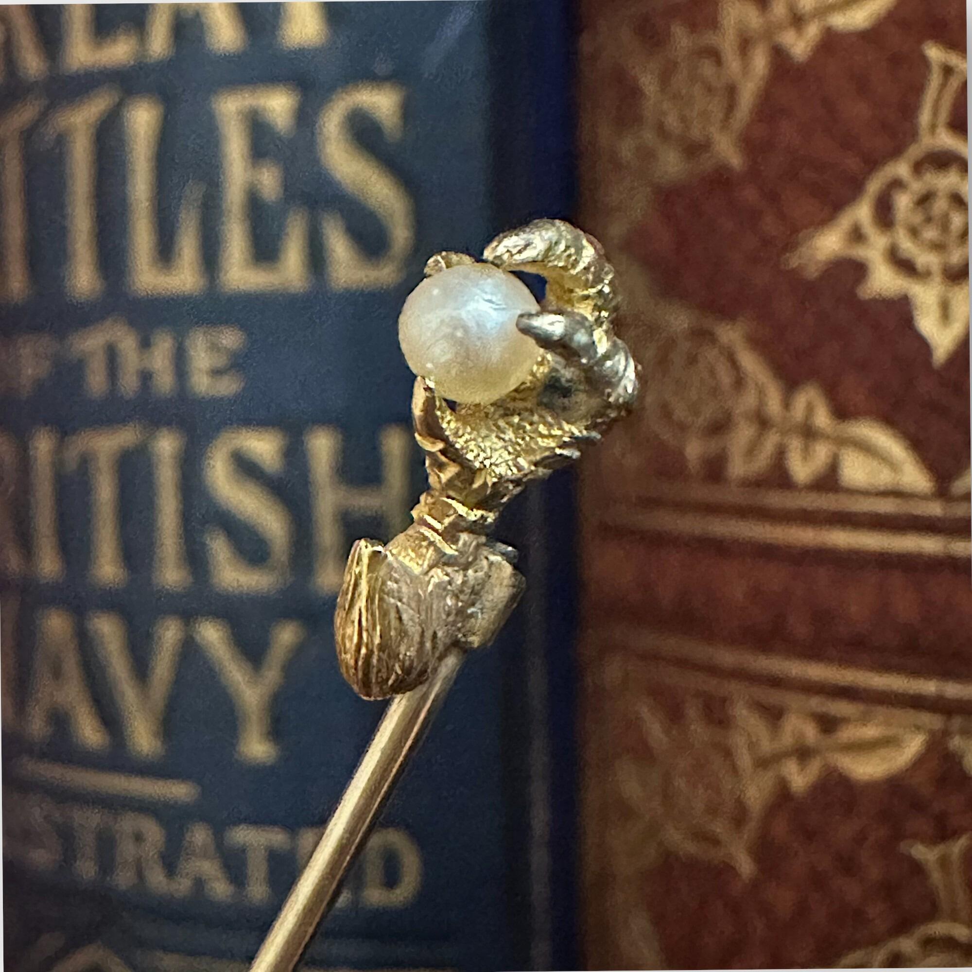 Victorian 18ct Gold Eagle Claw Pearl Stick Pin, Circa 1890, books in the background.