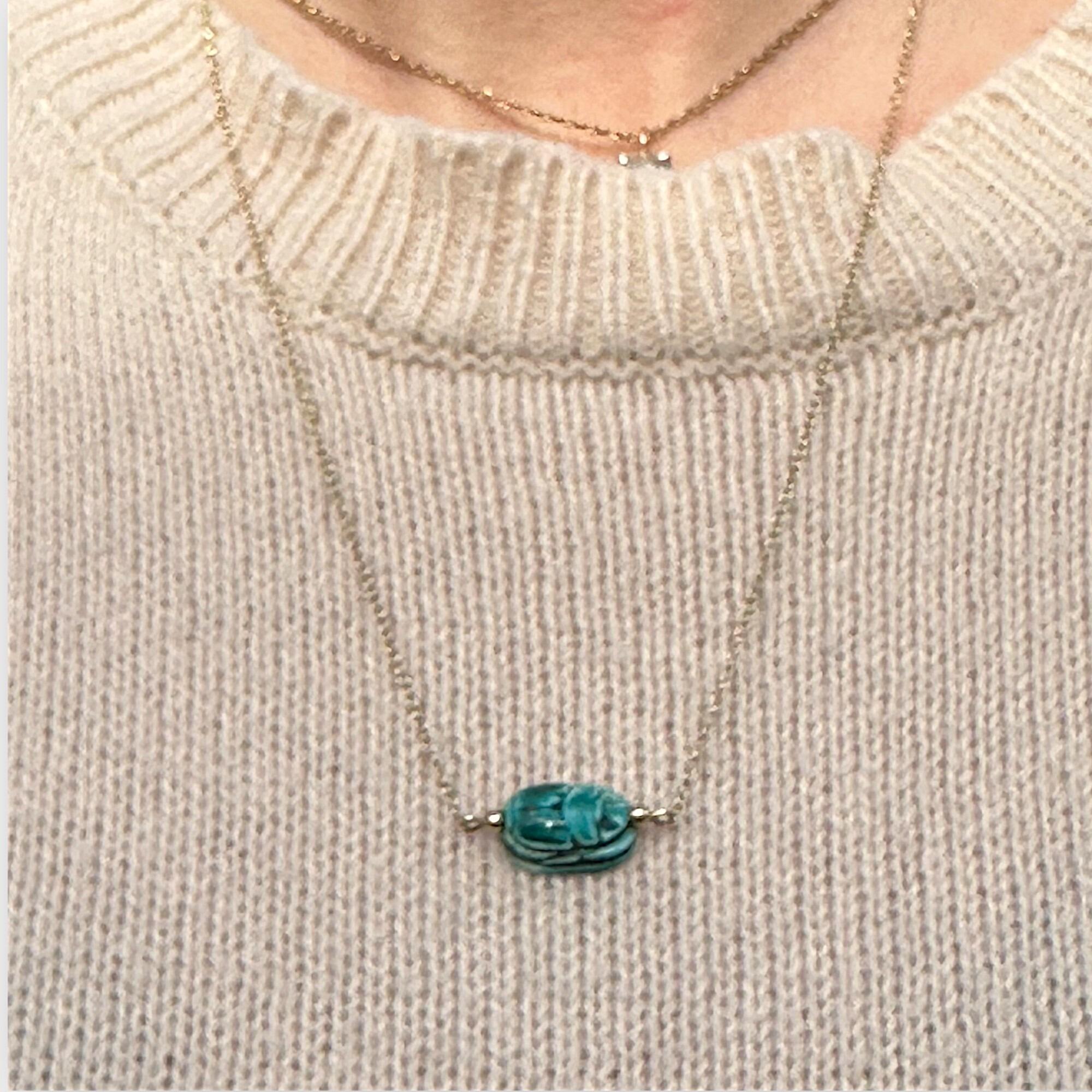 9k Gold Blue Faience Scarab Necklace – Egyptian Revival Pendant displayed on models neck.