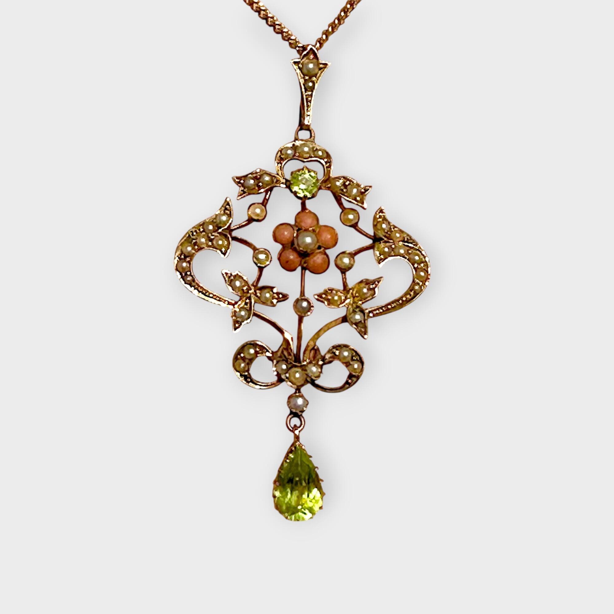 Art Nouveau 9k gold Lavaliere Pendant Peridot & Pearl Floral Motif, grey background.ackground
