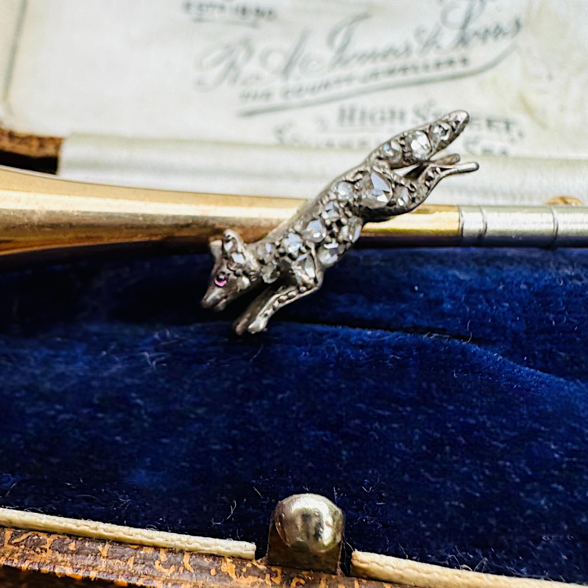 15ct Gold & Platinum, Diamond Running Fox on Bugle Brooch, displayed in antique box