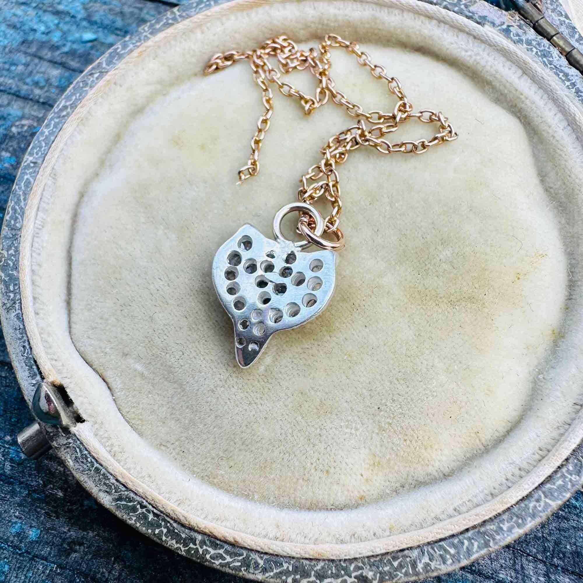 Vintage Fox Head Pendant: Rose Cut Diamonds, Ruby Eyes, Silver & 9ct Rose Gold displayed on antique box