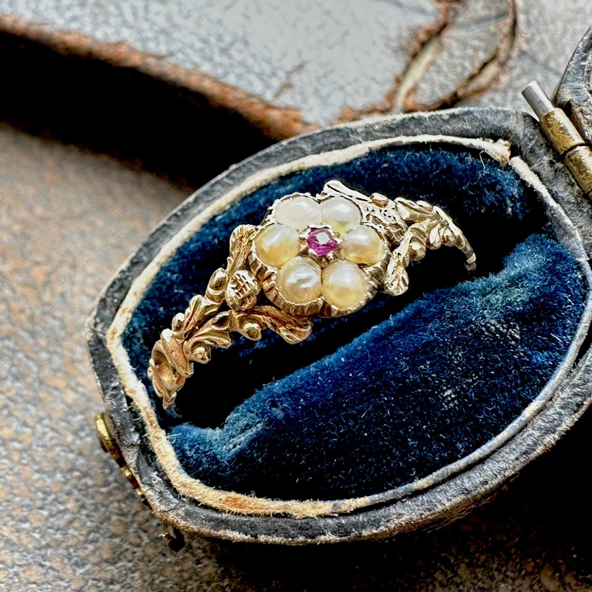 side view of Antique Georgian Regency Pearl & Ruby Daisy Ring displayed in antique box