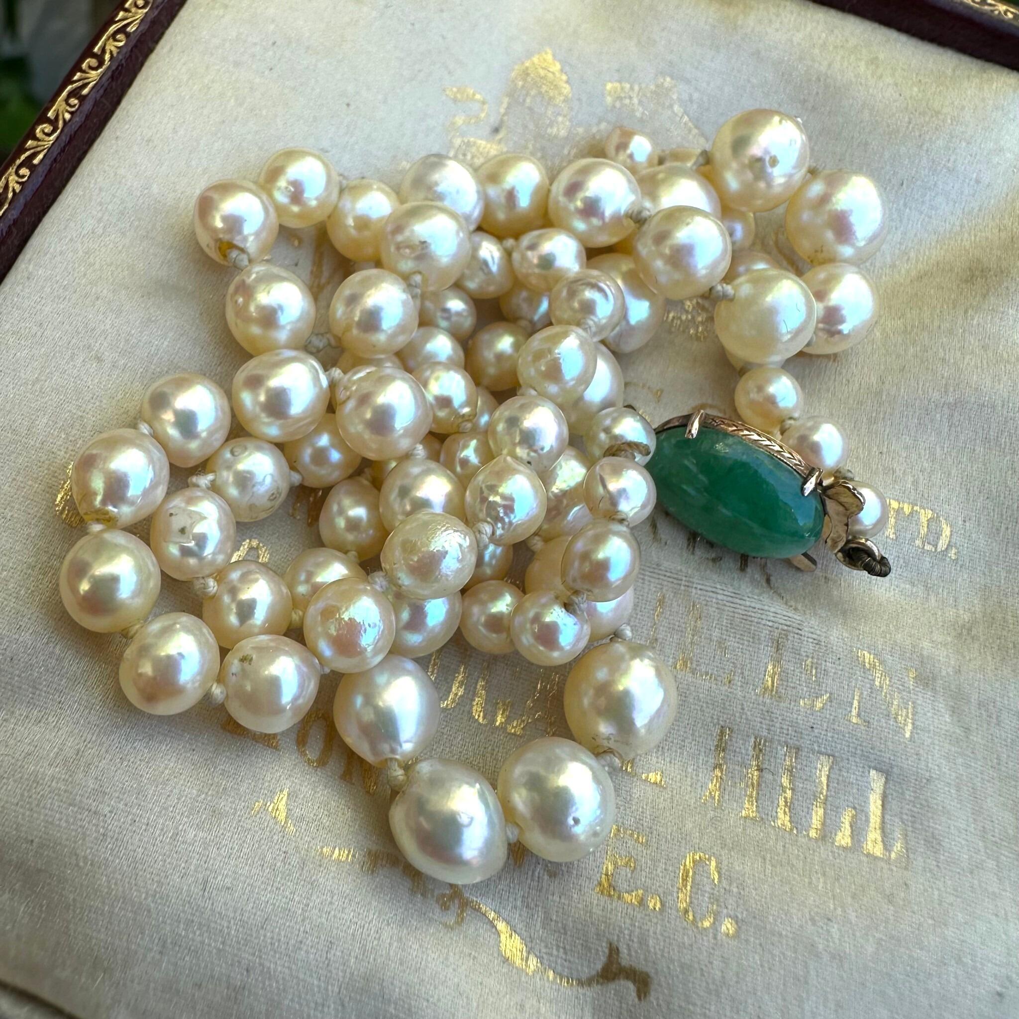 Antique Cultured Saltwater Baroque Pearl & 14k Gold Jadeite Clasp Necklace displayed on antique box