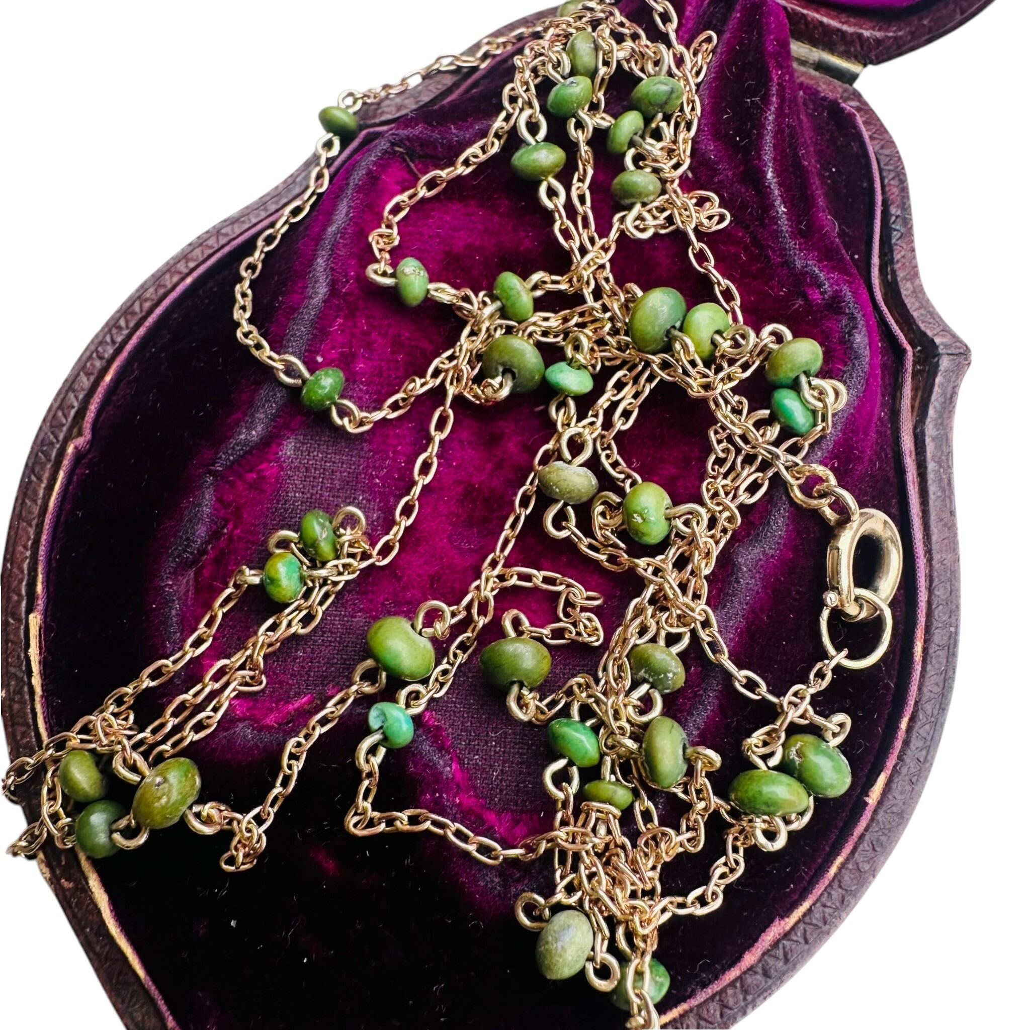 Antique Edwardian 9ct Rose Gold Turquoise Bead Guard Chain displayed on antique box with white background