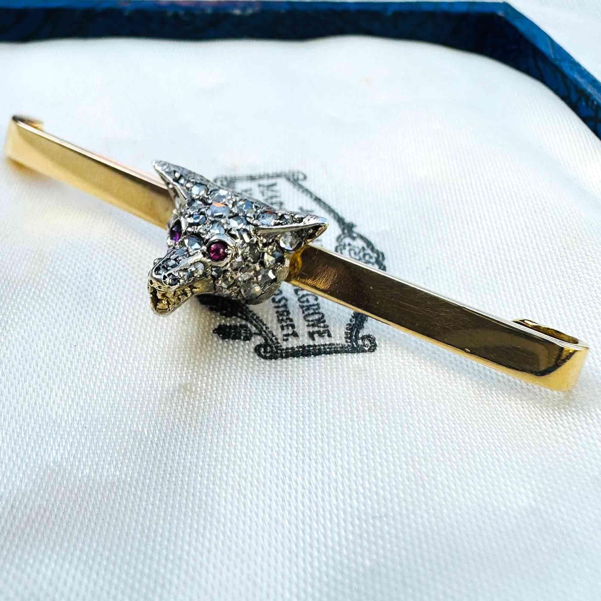 Antique diamond fox head brooch with rose cut diamonds, ruby eyes, and gold teeth detail