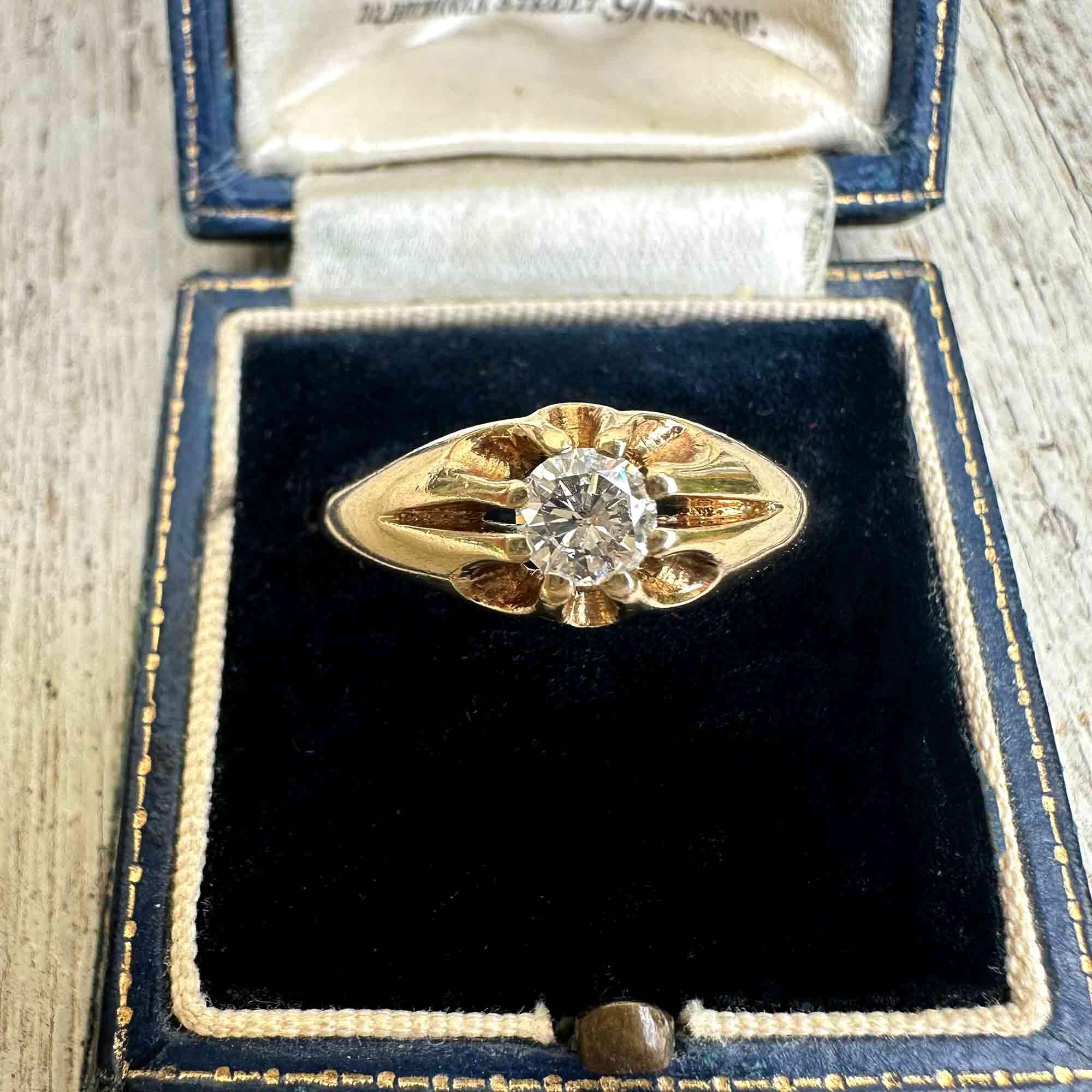 Gents gold diamond solitaire gypsy ring in antique box.
