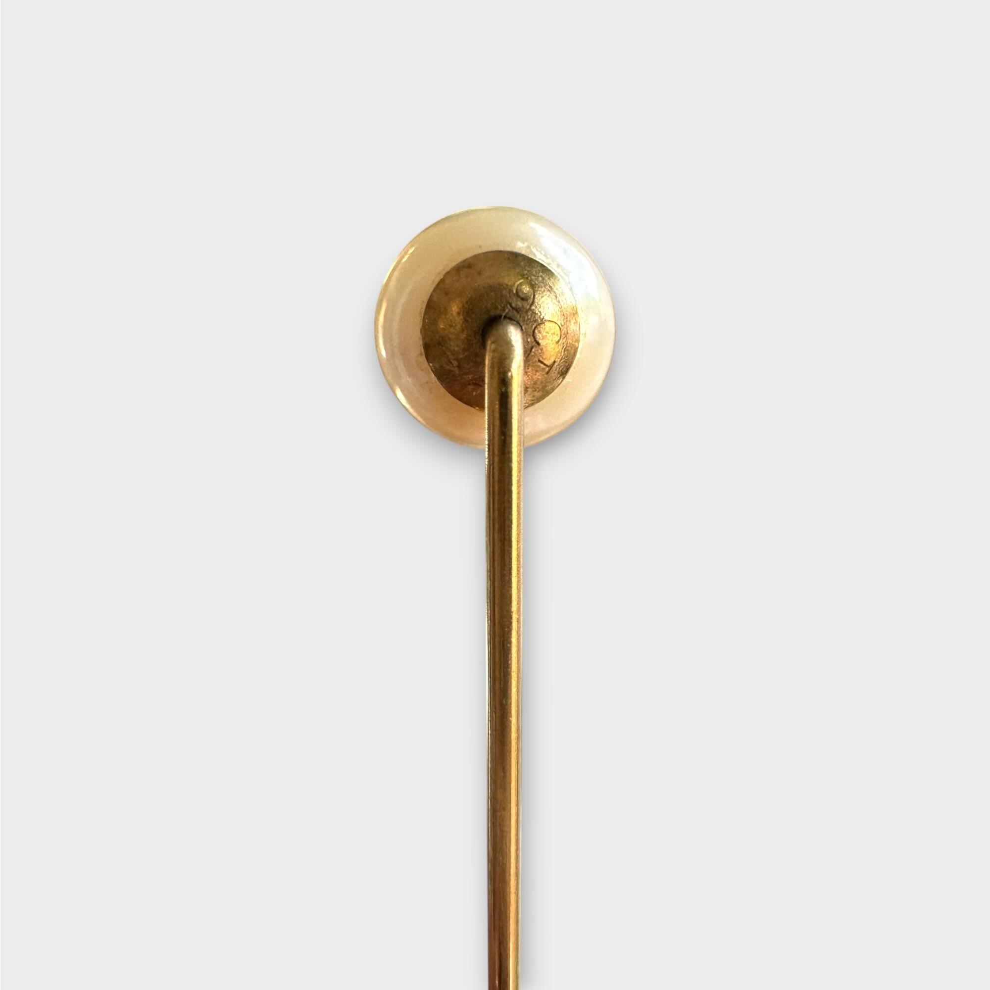 Late Art Deco 9ct gold 7mm Cultured Saltwater pearl stick pin on grey background, back view.