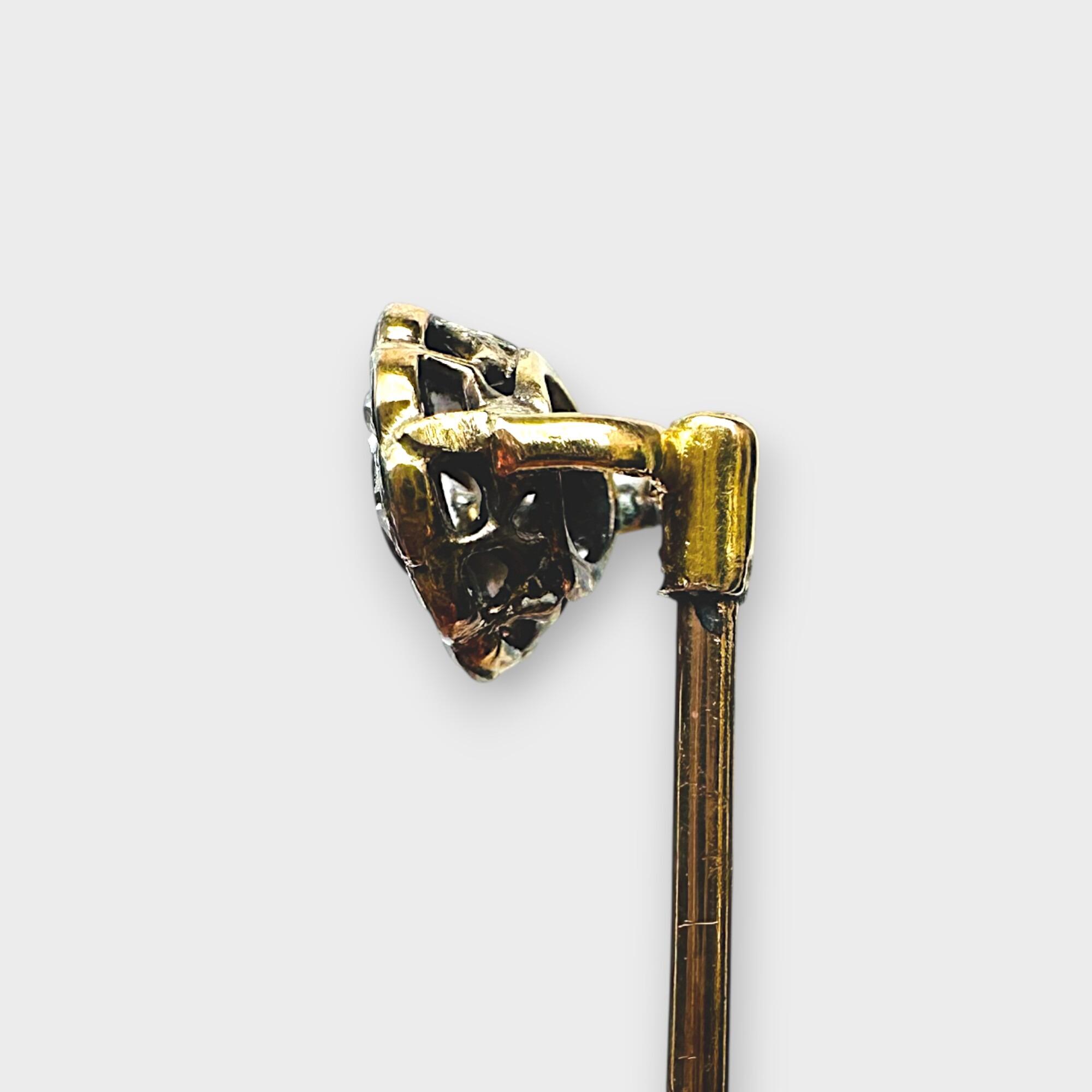 side view, Antique diamond stick pin in antique box with grey background.