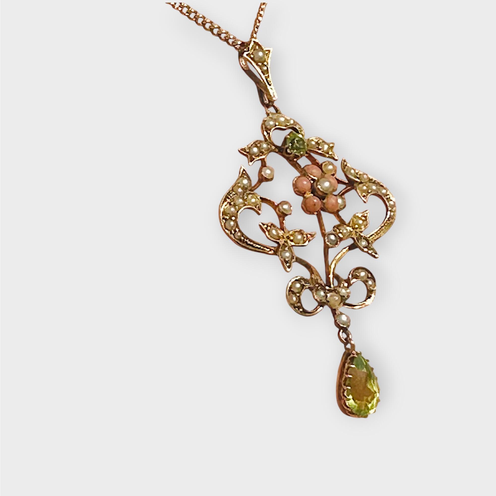 Art Nouveau 9k gold Lavaliere Pendant Peridot & Pearl Floral Motif, side view grey background. view gre