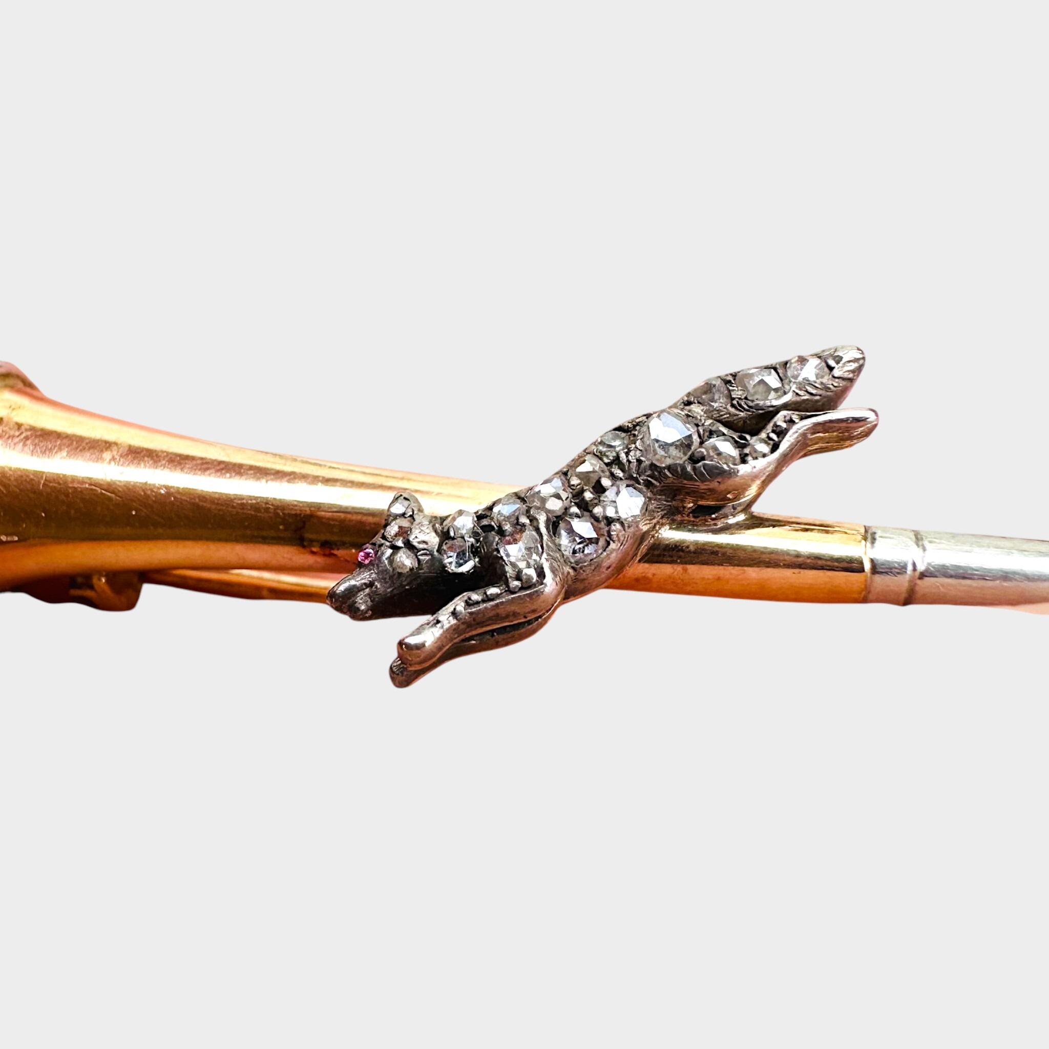 15ct Gold & Platinum, Diamond Running Fox on Bugle Brooch, grey background.