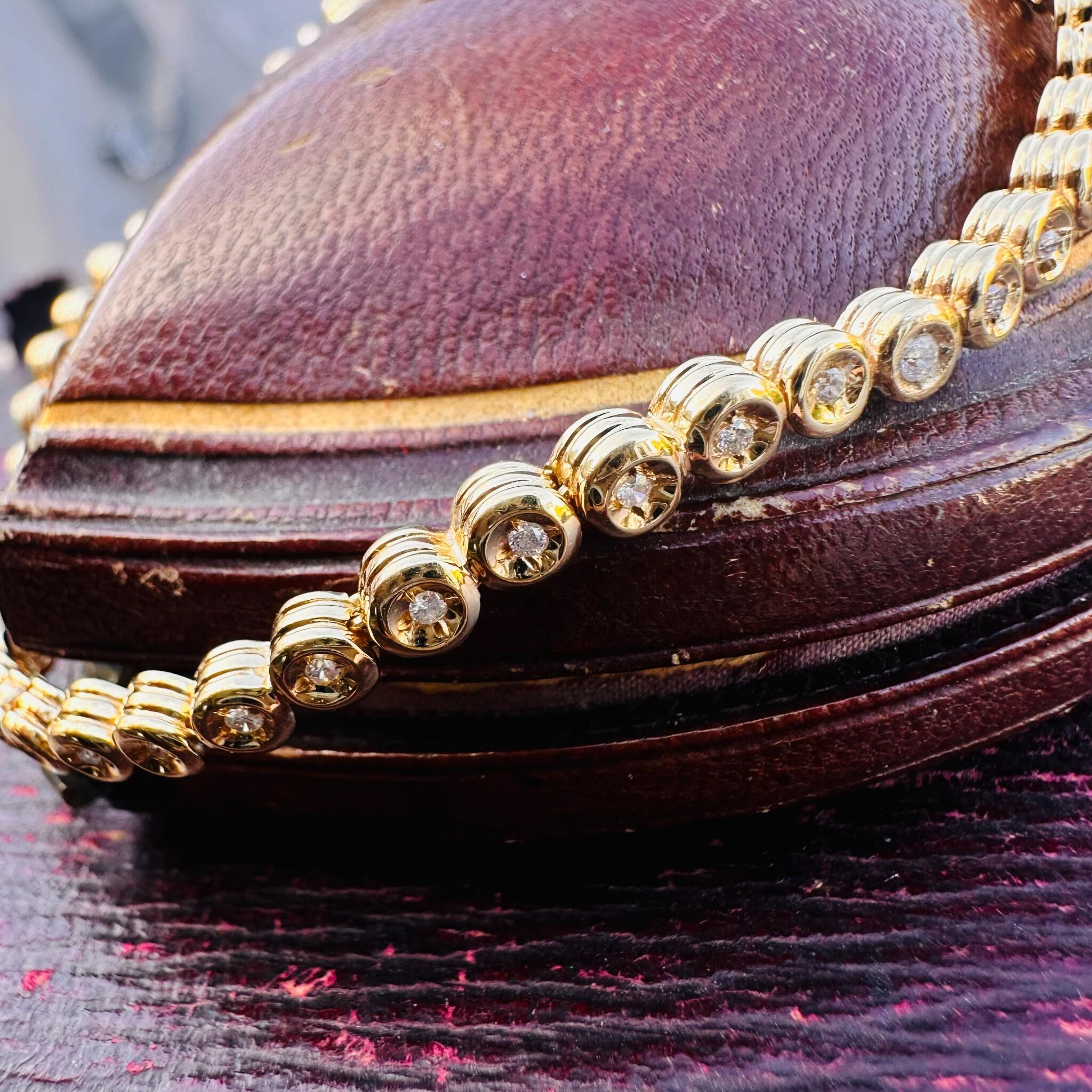 18ct Gold Diamond Line Tennis Bracelet draped over antique box
