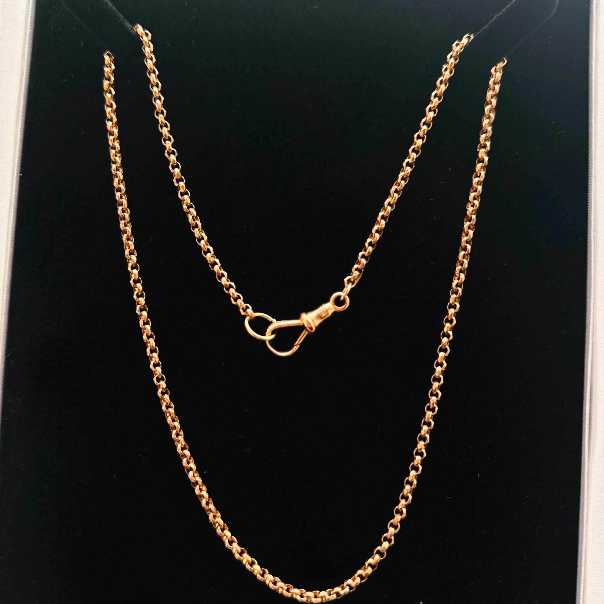 Rose Gold Faceted Belcher Chain with Dog Clip Clasp displayed on black velvet