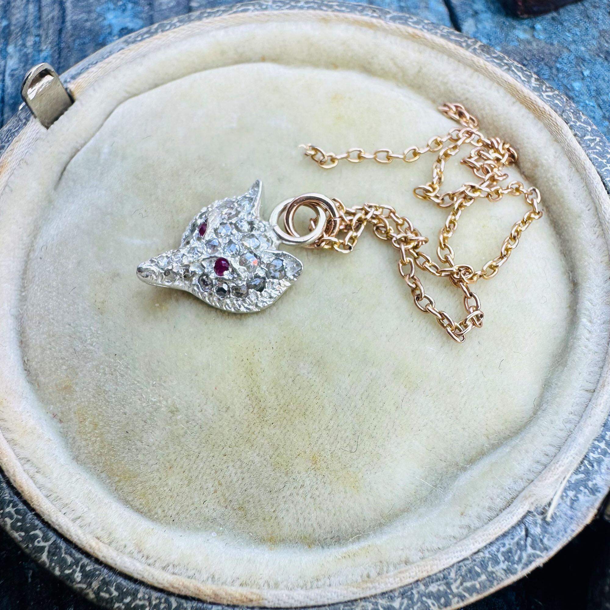 Vintage Fox Head Pendant: Rose Cut Diamonds, Ruby Eyes, Silver & 9ct Rose Gold displayed on antique box