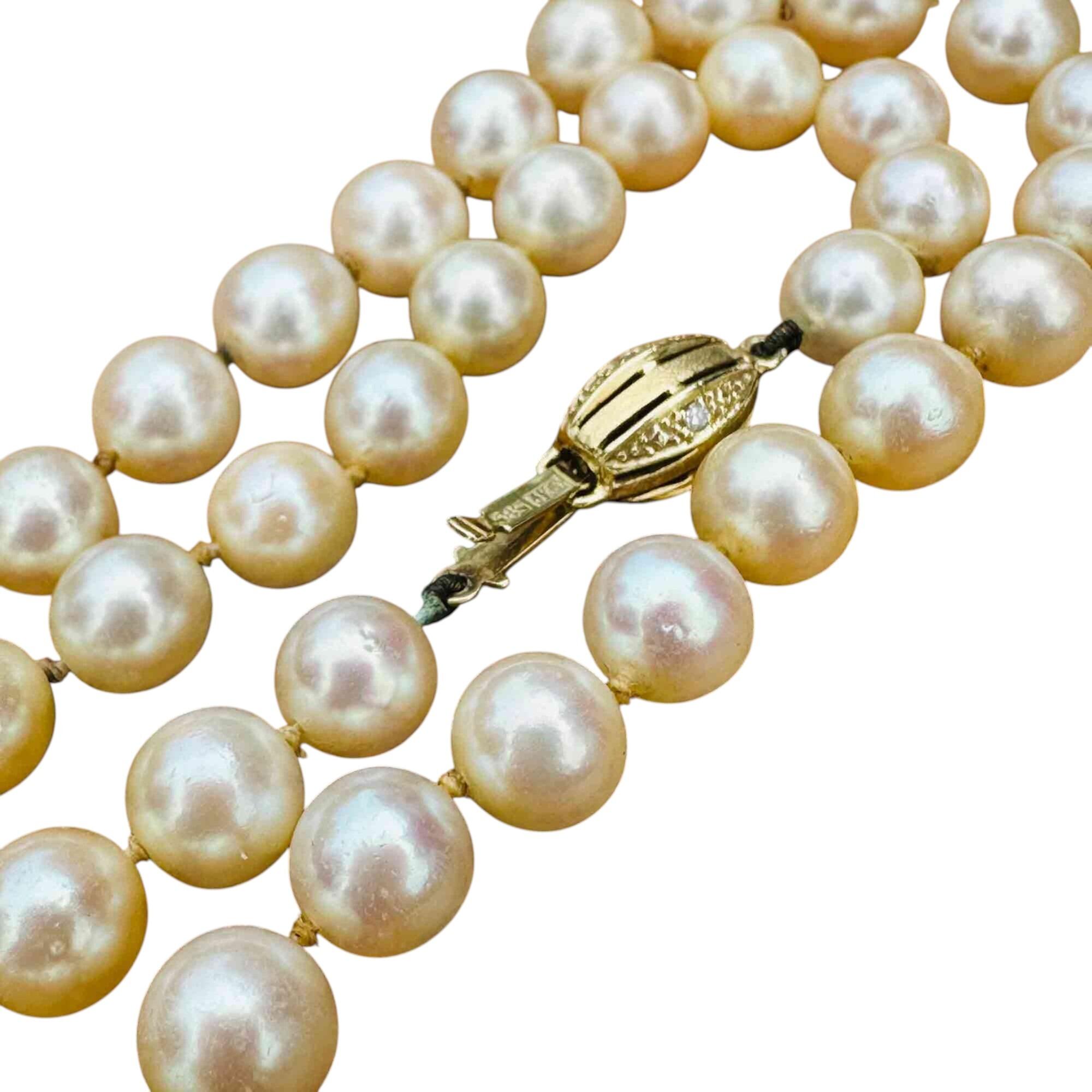 Vintage Cultured Saltwater Pearl Necklace and 14k Gold Diamond Clasp with white background