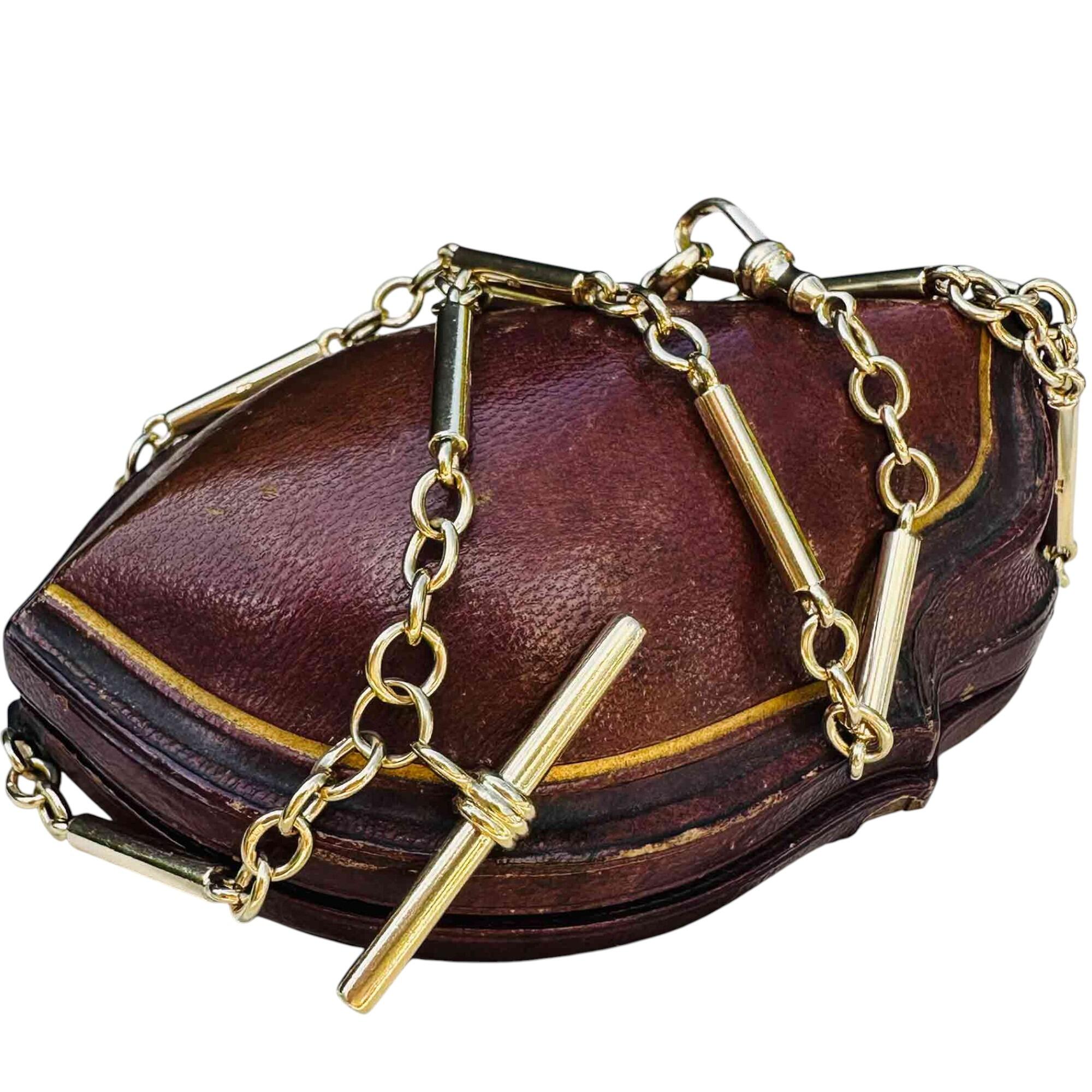 Vintage 9k Yellow Gold solid Tubular & Link Chain with T-Bar Pendant and Dog Clip worn on antique leather box.