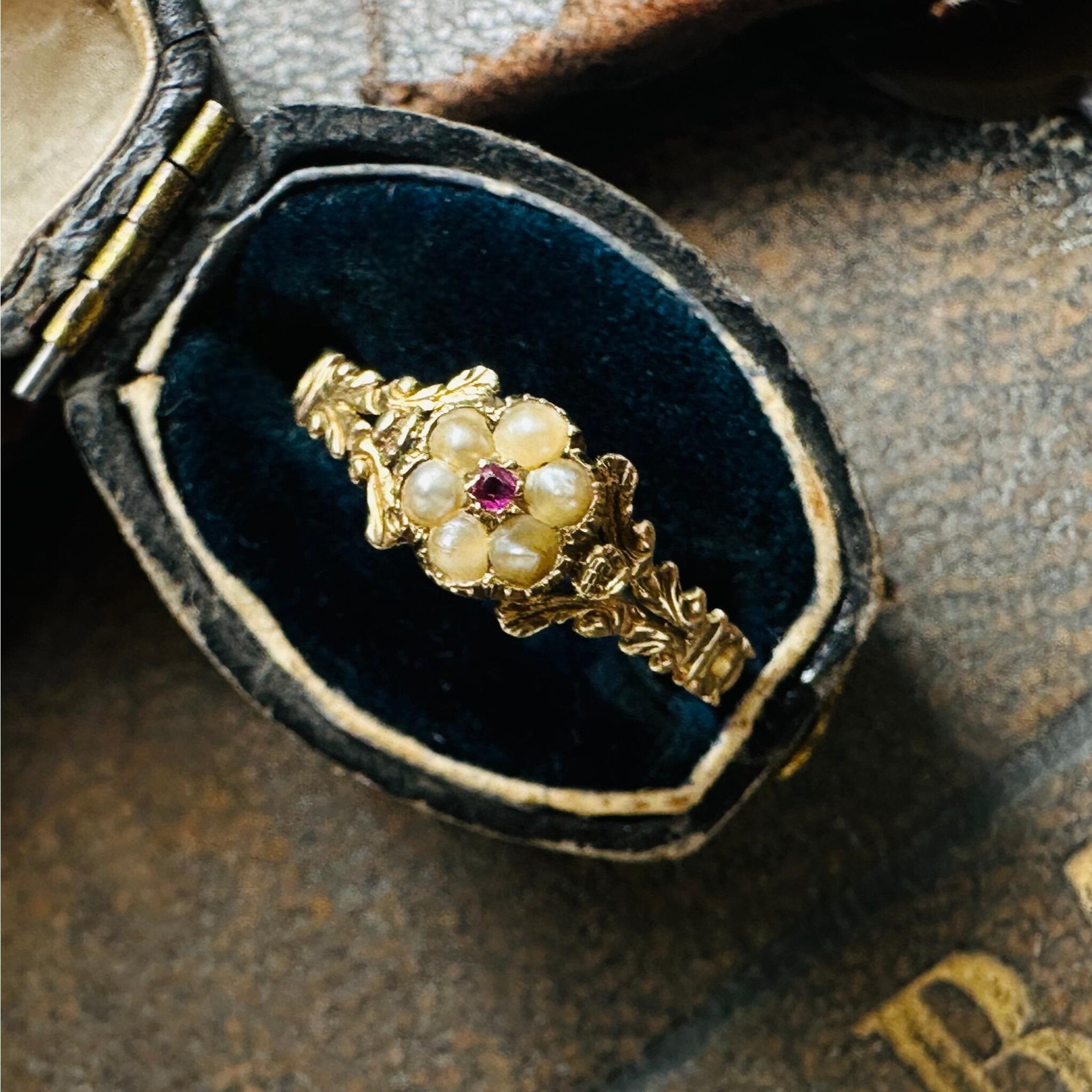 side view of Antique Georgian Regency Pearl & Ruby Daisy Ring displayed in antique box