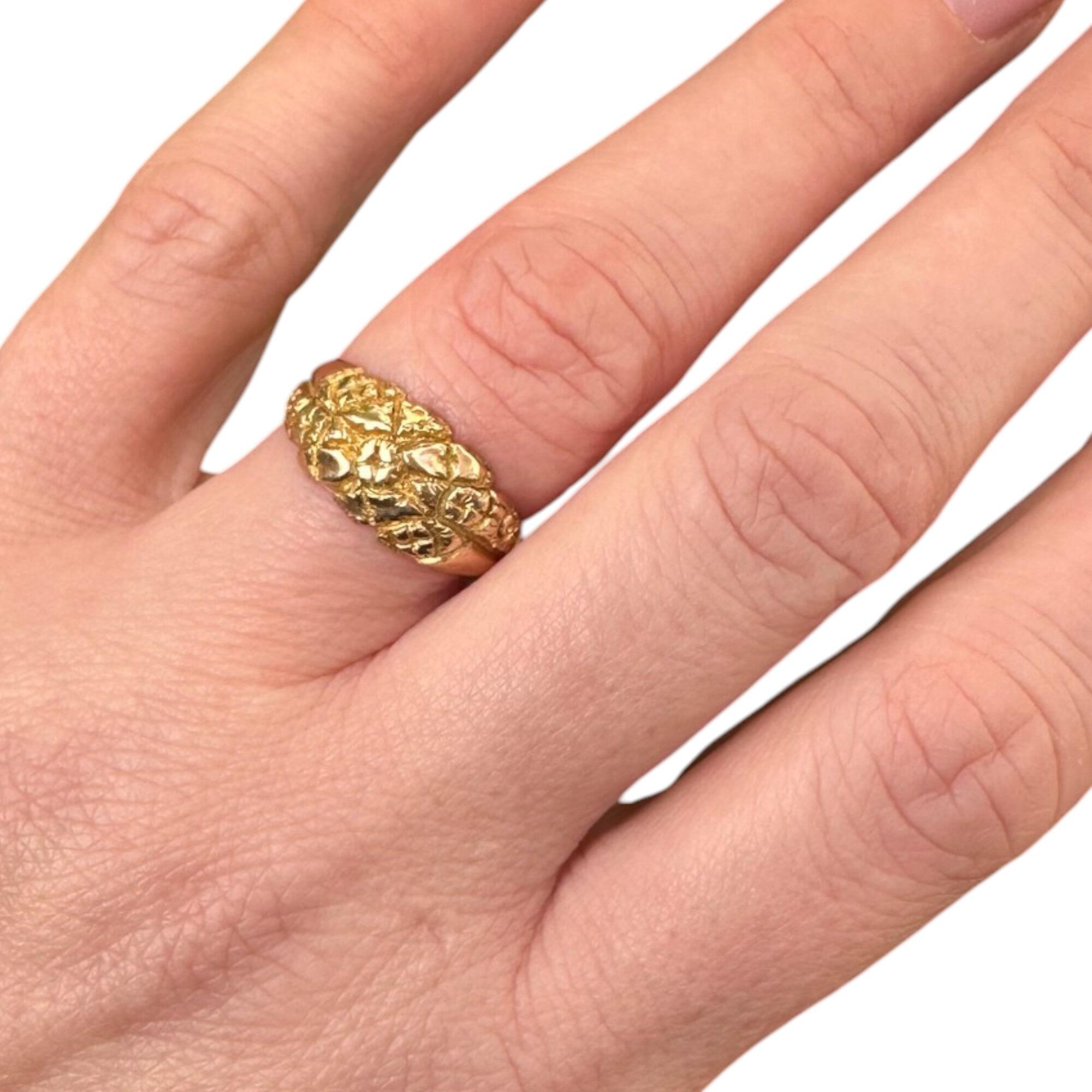 close up of Antique Art Nouveau Gold English Repoussé Ivy & Rose Dress Ring worn on models hand with white background