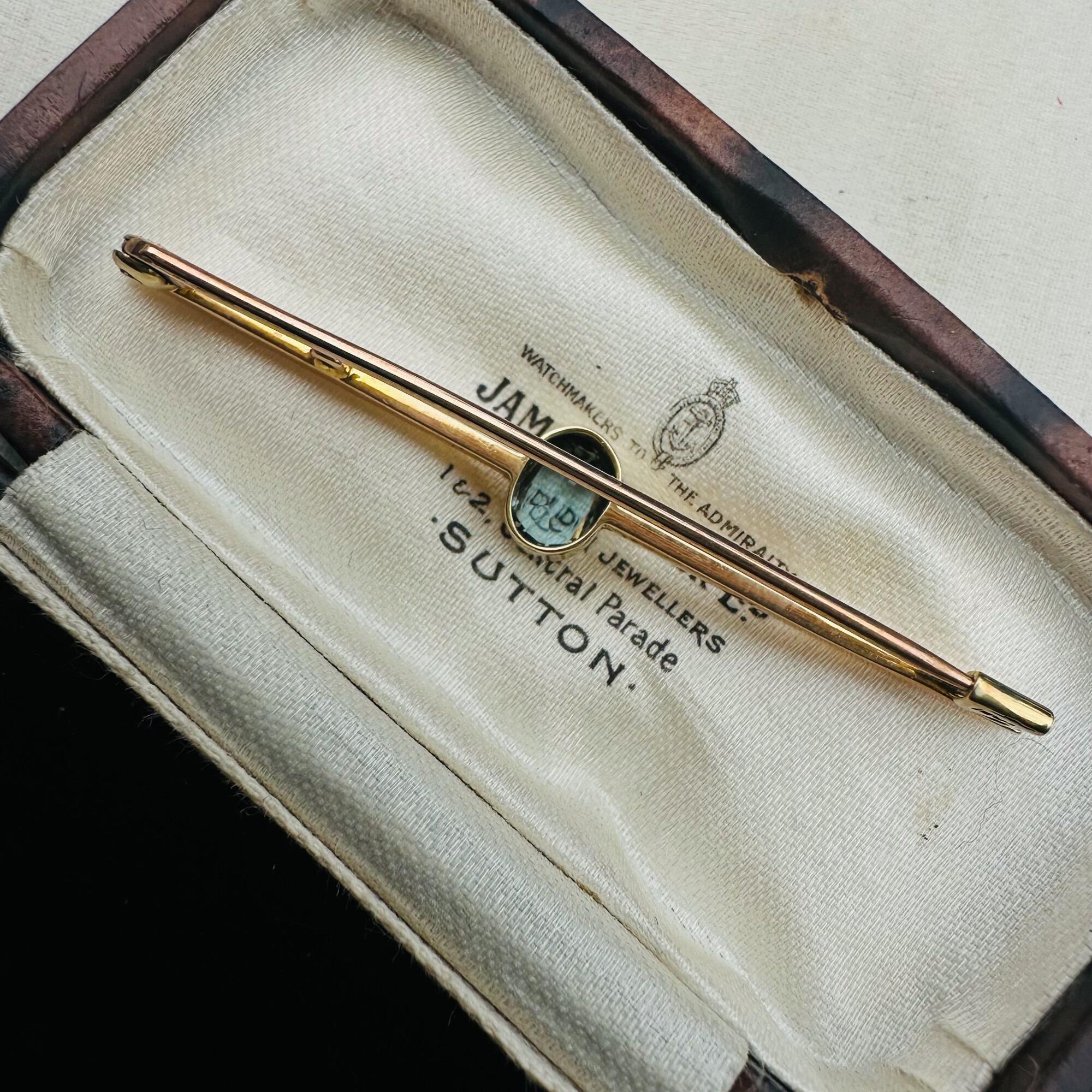 back view elegant Edwardian aquamarine bar brooch features a stunning 7x5mm oval aquamarine, mounted securely in a classic collet setting in antique box.