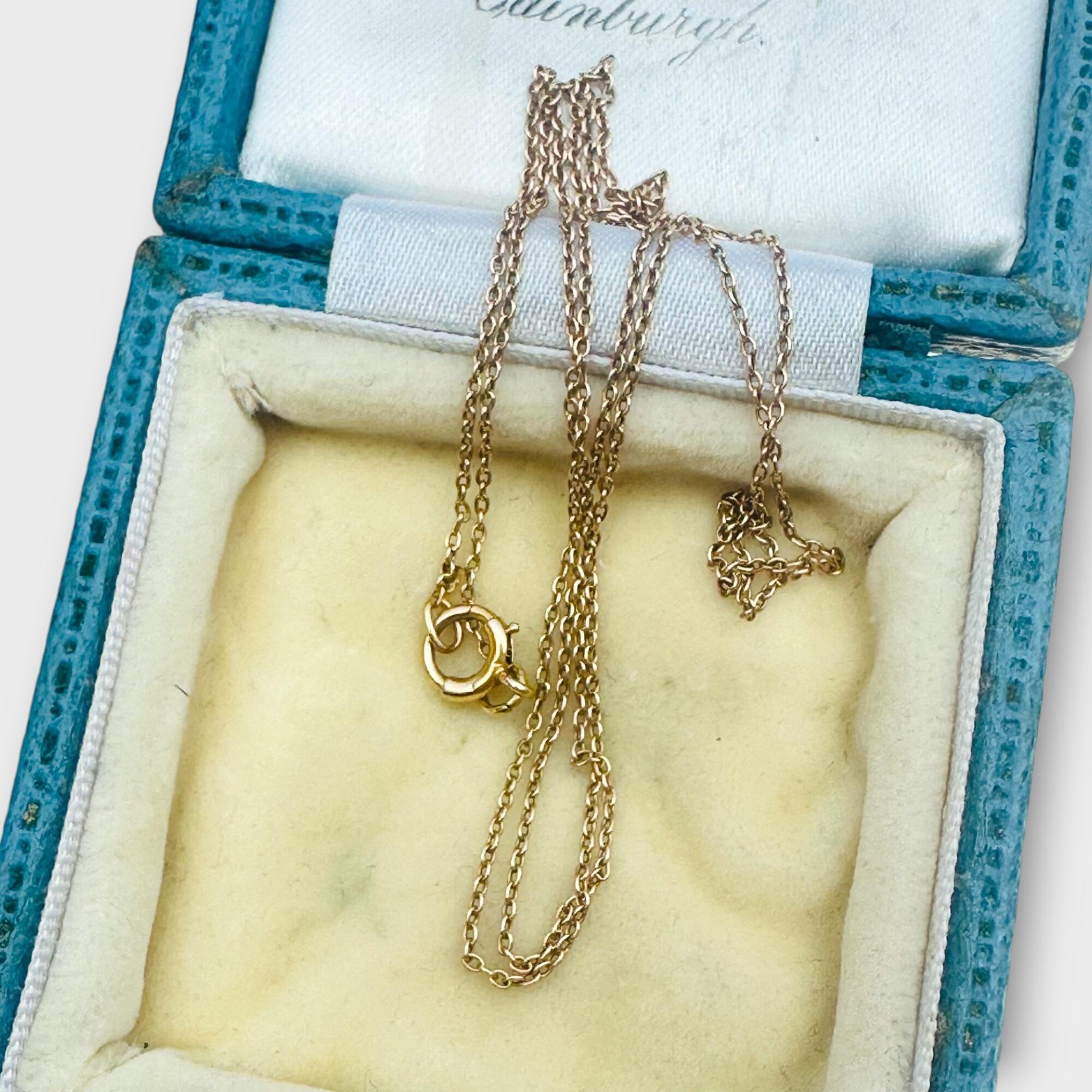 Full view of 20 inch / 51cm 15ct gold rolo chain, laid flat to show link detail
