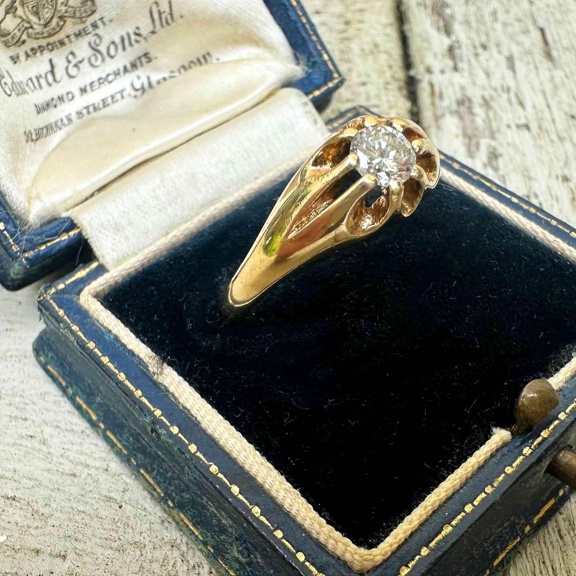side view, Gents gold diamond solitaire gypsy ring in antique box.