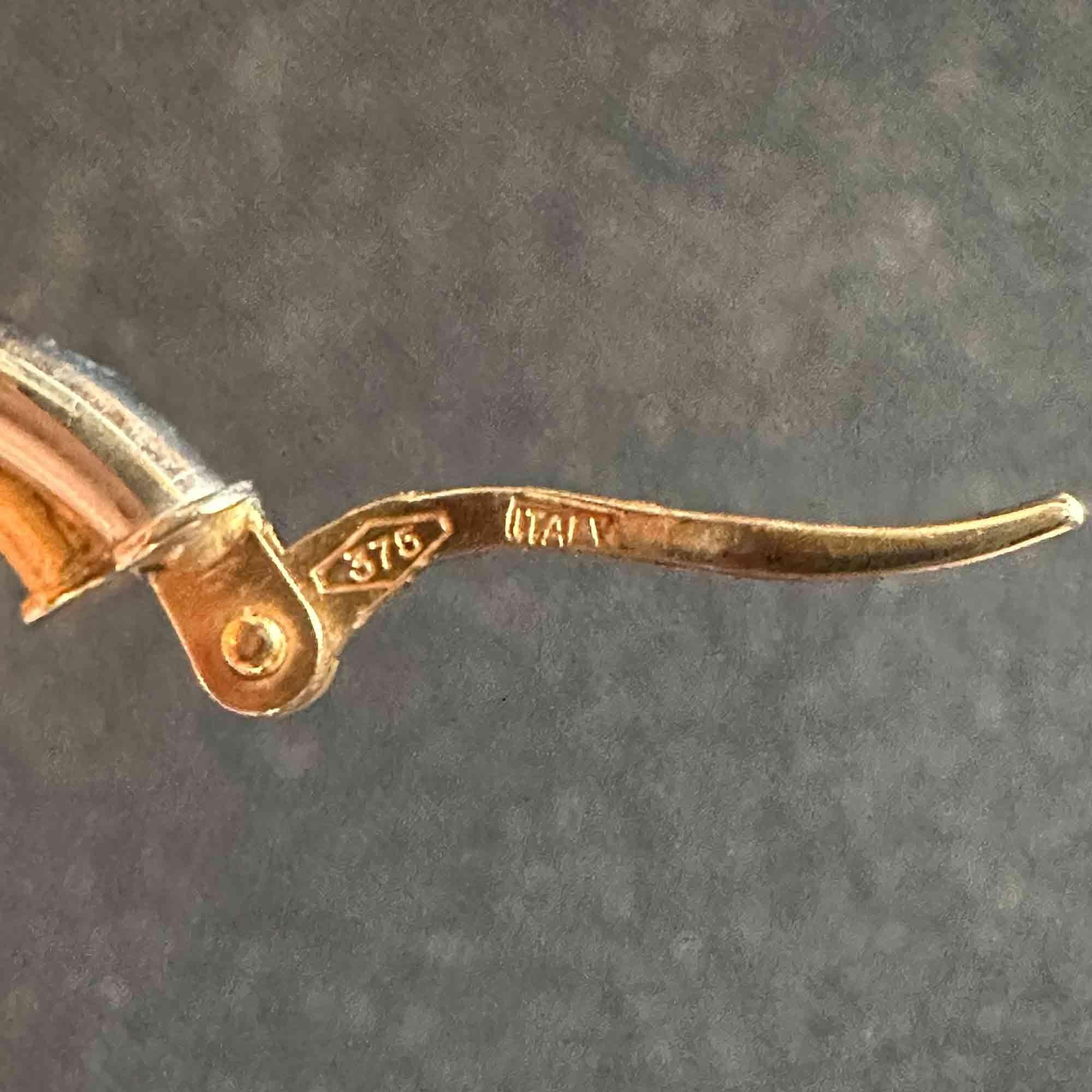 Italian bi-colour 9ct gold hoop earrings on grey background showing close up of hallmark.
