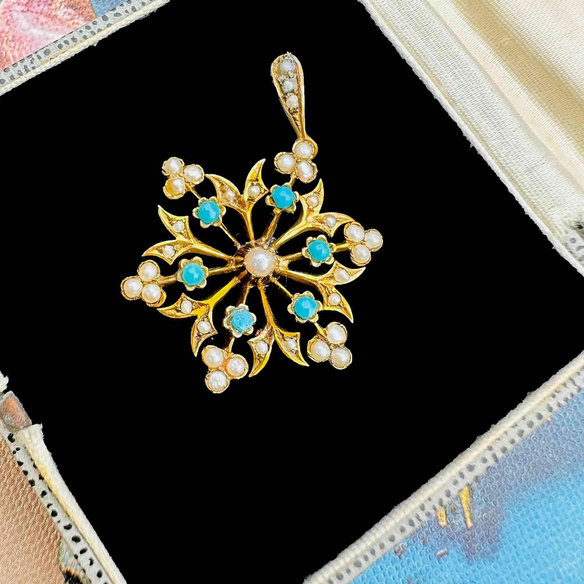 antique 9ct gold Turquoise and pearl starburst pendant on black velvet antique box.