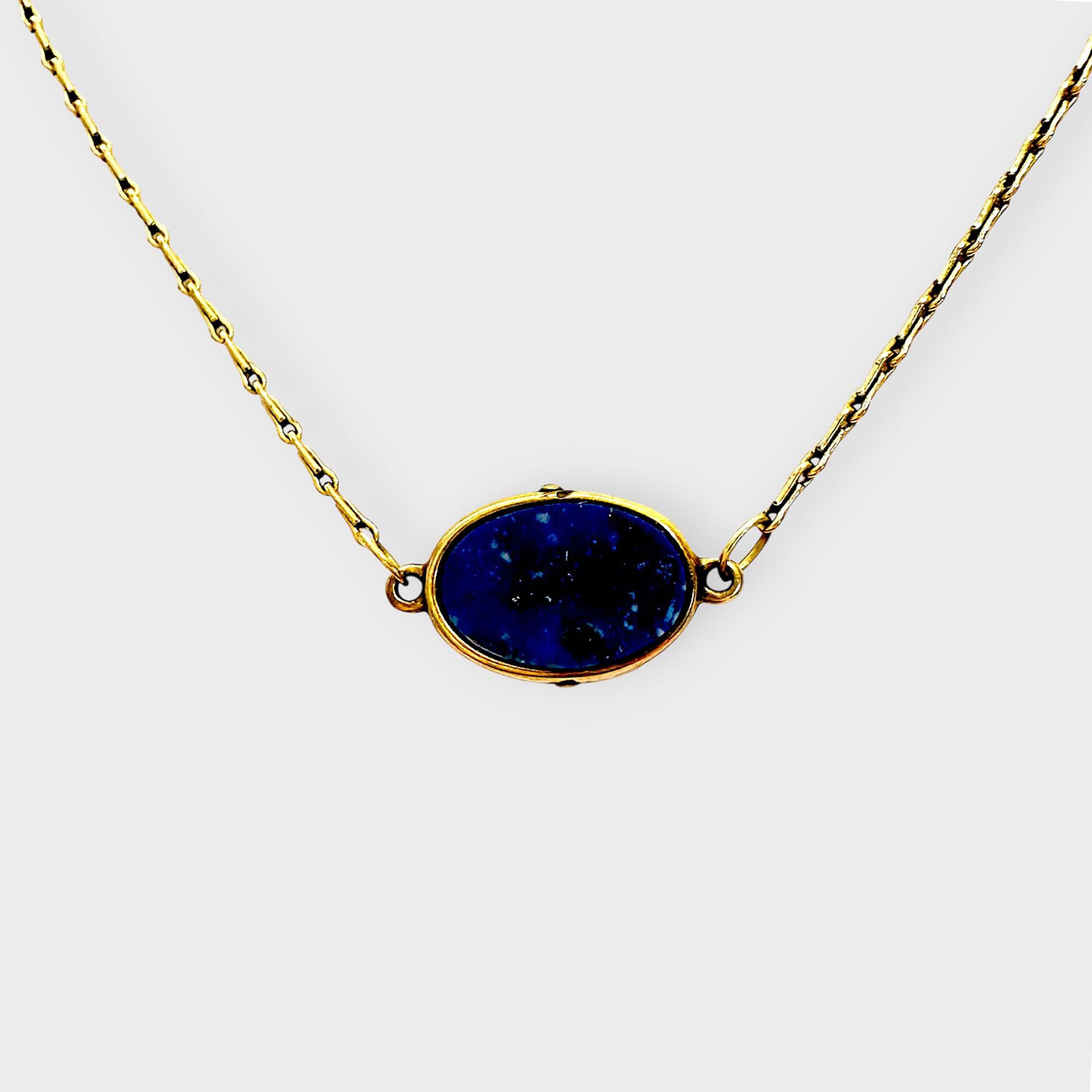 Vintage 9ct gold lapis lazuli pendant necklace on grey background