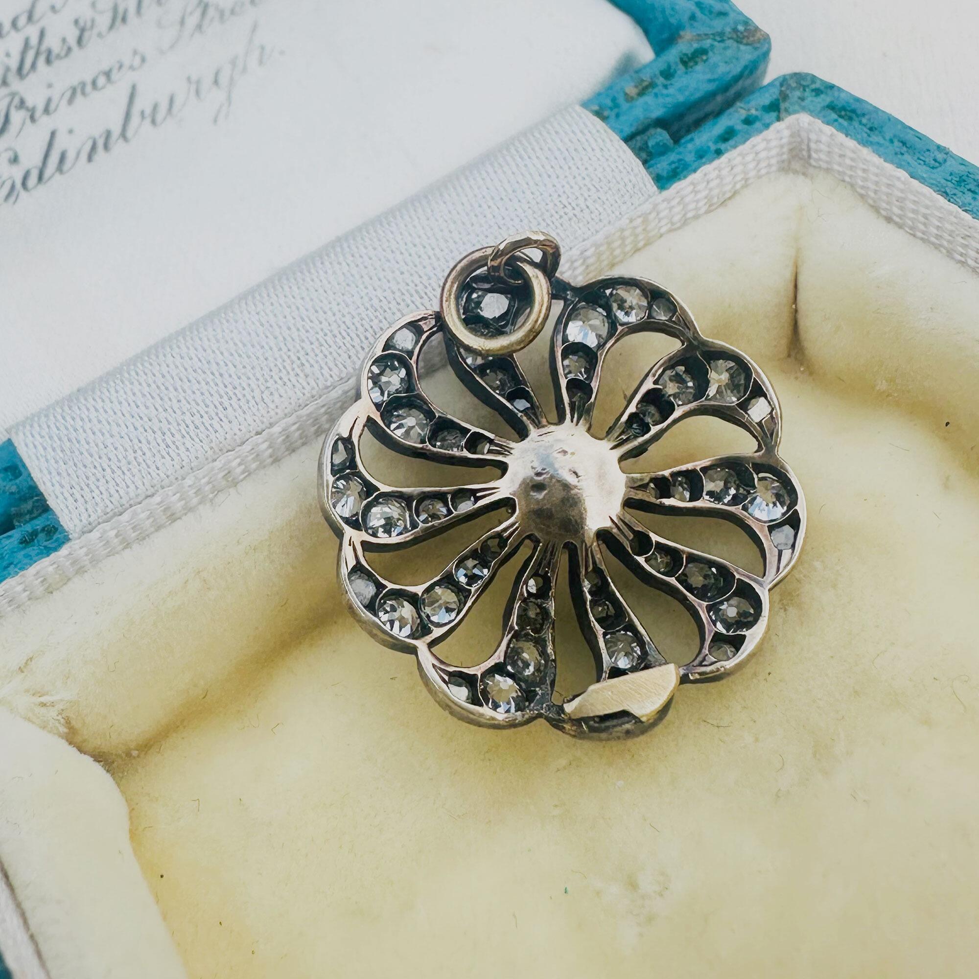 back view, antique diamond and pearl celestial sunburst pendant on antique box.