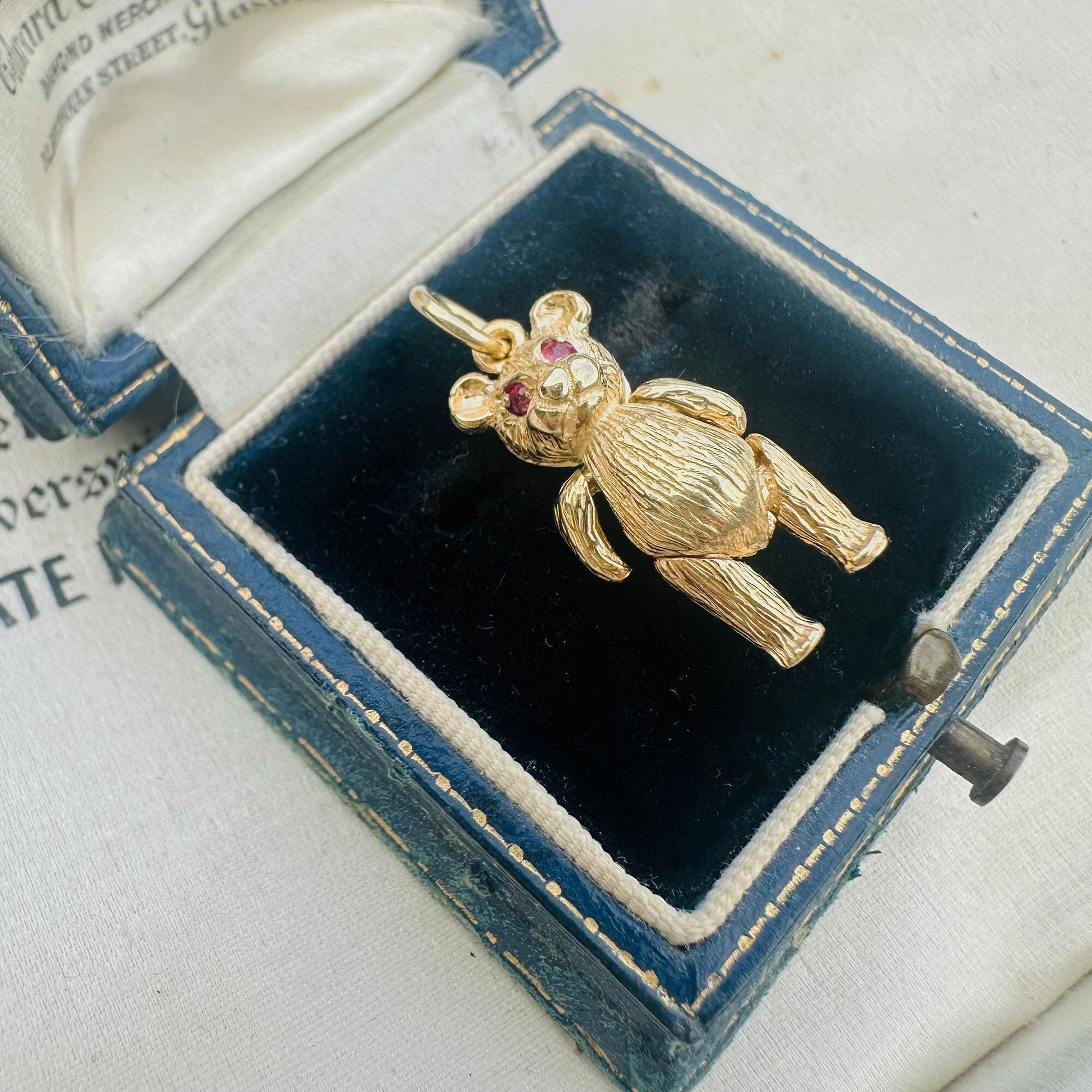 Vintage 9ct Gold Teddy Bear Pendant: Ruby Eyes, Articulated London Charm displayed in antique box